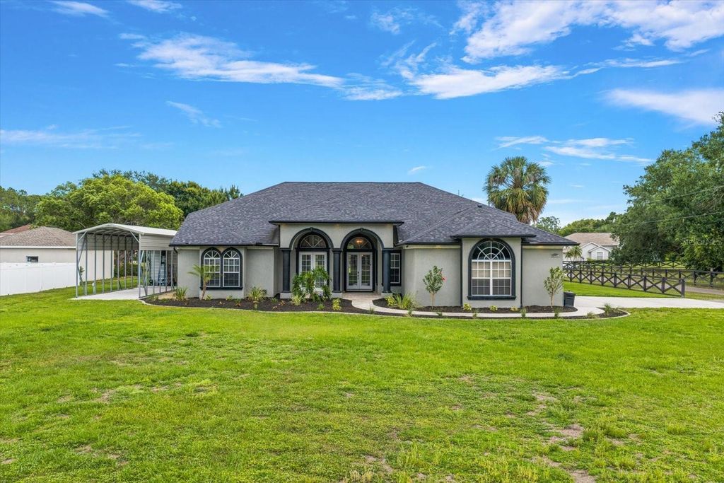 Photo of 18731 Crooked Lane, Lutz, FL 33548 (MLS # TB8503181)