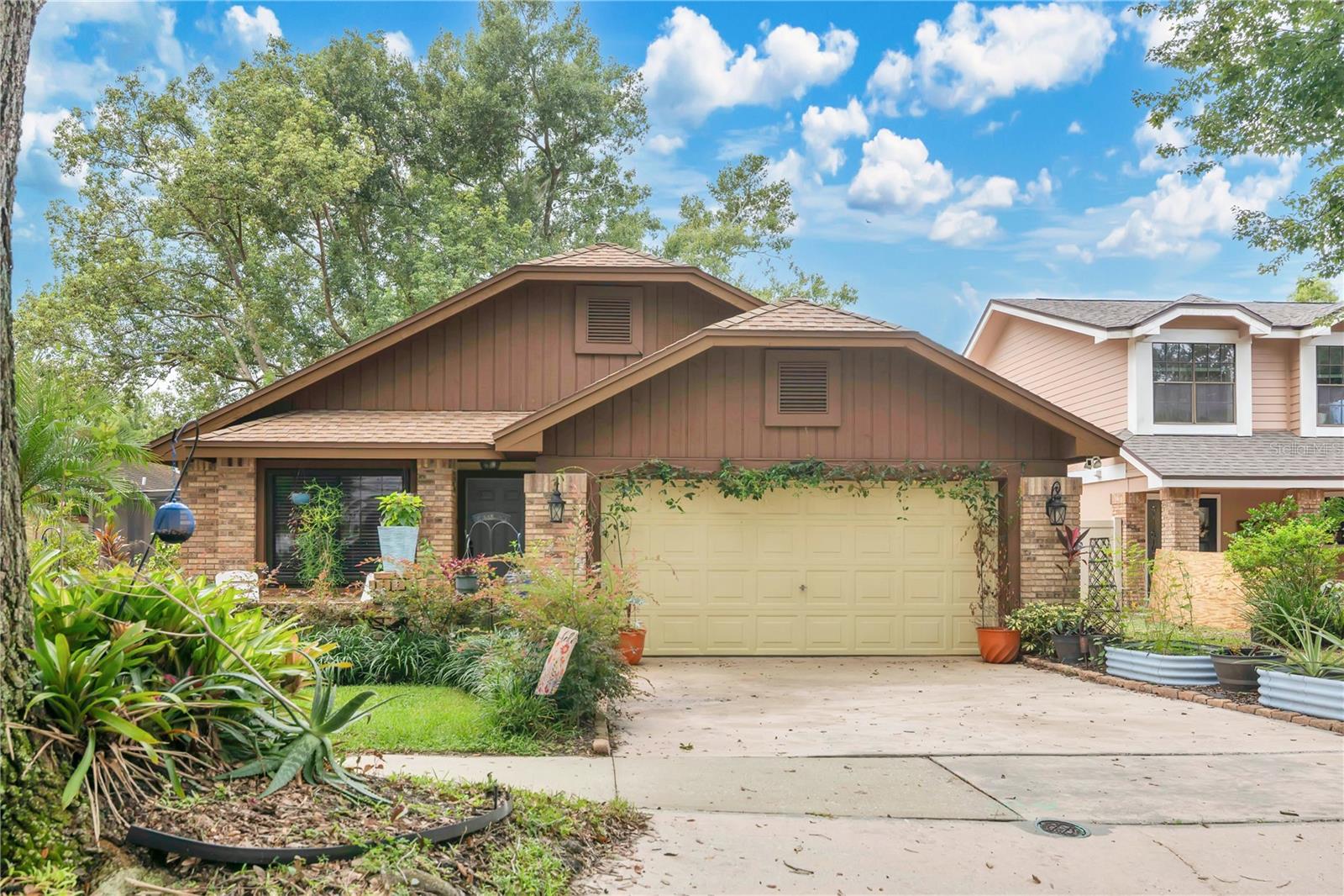 Welcome to Conway Living! This beautifully maintained lakefront home in the desirable Bryn Mawr community offers a rare opportunity to enjoy serene waterfront living just minutes from downtown Orlando, major roadways, shopping, and dining. Situated directly on Lake Farrar, the property provides spectacular sunset views framed by tropical landscaping and mature trees, creating a peaceful retreat right in the heart of the city.
From the moment you arrive, the charm of this home is evident. A lush garden patio invites you toward the welcoming entryway. Inside, you’ll find an open floor plan that seamlessly connects the dining and living areas. Custom built-in bookcases, farmhouse-style shelving, and a beautiful wood-burning fireplace create warmth and character while also providing functionality and storage. Large windows and sliding glass doors fill the living area with natural light and extend your living space into the outdoors. The screened porch on the south side of the home, offers a comfortable space to relax or entertain while enjoying the lake and landscaped yard.
The newly remodeled kitchen (2023) is a standout feature, designed with both beauty and practicality in mind. Highlights include granite countertops, thoughtfully integrated electrical outlets inside cabinetry, a custom-built bistro area, and a convenient pass-through window for serving meals to the dining area. Whether you’re cooking a family dinner or hosting guests, this kitchen makes it easy and enjoyable.
The home offers 3 bedrooms and 2 bathrooms, including a spacious primary suite. The primary bath boasts granite countertops, dual sinks, and a low-entry shower, blending style with accessibility. Additional thoughtful updates throughout the home include decorative faceplates, a Ring doorbell, and a Ring camera floodlight, and NEST HVAC control system all showcasing the pride of ownership.
The outdoor space is equally impressive. Multiple plumeria and pineapple plants bring vibrant color and charm, while an irrigation system with a smart Rachio weather sensor keeps the landscaping low-maintenance and thriving. Enjoy gatherings on the paver patio, quiet mornings on the screened porch, or evenings watching the sun set over the water.
Practical upgrades include a Woder water filter system and well-maintained major appliances, ensuring the home is truly move-in ready. Extra electrical outlets, storage shelves and work benches in the garage offer a creative and convenient work space. Every detail has been considered to create a space that is comfortable, functional, and designed for modern living.
Located in the established Bryn Mawr neighborhood, residents also enjoy tree-lined streets, nearby parks, and a strong sense of community. With easy access to the Orlando International Airport, Conway Chain of Lakes, and highly rated schools, this home is an ideal blend of convenience and tranquility.
Don’t miss your chance to own this one-of-a-kind lakefront property. Schedule your showing today and discover the best of Conway living in Bryn Mawr!
