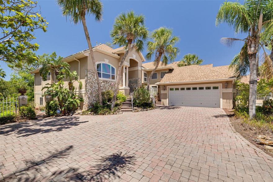 Welcome to this truly unique and NATURE-INSPIRED residence, custom-built in 1992 by its original builder-owner and packed with thoughtful upgrades and luxurious features. Tucked away just outside the gates of Pasadena Yacht & Country Club and nestled along the 17th green, this home is surrounded by lush trees, a nature preserve, and park views—offering a peaceful, walkable lifestyle just blocks from Gulfport Beach, Beach Blvd, the Pinellas Trail, and the waterfront recreation center.  Boasting 3 BEDROOMS, 3 FULL BATHROOMS, and an oversized 2-car garage with an EV charger hookup, this home is as practical as it is beautiful. Inside, you'll find soaring VAULTED CEILINGS, custom blinds, and fine finishes throughout—like plantation shutters in the chef’s kitchen, which features stunning live-edge granite counters, a paneled refrigerator, and a cozy breakfast nook. Adjacent to the kitchen, the indoor laundry room adds everyday convenience. The primary suite is a serene retreat with its own PRIVATE DECK overlooking the trees, a huge walk-in closet, and a spa-like bath complete with separate vanities, a garden tub, and a separate shower. The rear family room, lovingly dubbed the “tree house,” offers PANORAMIC VIEWS of the surrounding oaks and orchids, a gas fireplace, and a COFFERED CEILINGS for a touch of architectural elegance. Entertain with ease in the formal living room with a WET BAR or host outdoor gatherings on one of THREE ELEVATED DECKS—including a grilling area off the kitchen and a spacious deck off the family room. Though uninsured, the FULLY FINISHED LOWER LEVEL offers an additional 1,669 sq ft of living space, giving you room to grow or enjoy as you see fit. Here is where you'll find your full 3rd bathroom, a large open floorplan ideal for a work-space, home gym, or media room and there's even a spacious closet, perfect for holiday decor, or convert to your private wine cellar! Sustainability and efficiency shine here with paid-off SOLAR PANELS (2019), averaging less than $100 per month in electricity bills, a 2015 roof and gas water heater, and HVAC systems updated in 2018. A brand-new 2024 GENERAC GENERATOR is powered by NATURAL GAS, which also fuels the cooktop, fireplace, water heater, and BBQ hookup on the side balcony. Walkable. Unique. Nature-inspired. Come experience this exceptional home that feels like a private retreat within reach of everything Gulfport has to offer.