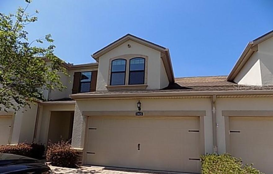 Beautifully maintained 3BR/2.5BA townhome offering private, serene views and a like-new feel throughout. The thoughtfully designed open floorplan features a spacious, updated kitchen with stainless steel appliances, range hood, wall oven, decorative backsplash, and ample cabinetry—perfect for both everyday living and entertaining. The first-floor primary suite provides comfort and convenience, while upstairs you’ll find a versatile open loft, two additional bedrooms, and a bonus storage room ideal for organization or hobbies. A 2-car garage completes the home. Located in the desirable Harmony at Lakewood Ranch community, residents enjoy resort-style amenities including a clubhouse, state-of-the-art fitness center, sparkling pool and spa, outdoor kitchen and grilling areas, scenic walking trails, playground, and dog park. Maintenance-free living allows for a low-maintenance lifestyle, all within the award-winning Lakewood Ranch master-planned community, offering parks, nature trails, sports courts, golf, and convenient access to top-rated shopping, dining, and entertainment.