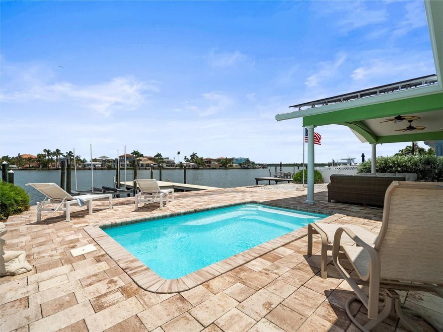 Need a 1031 replacement with income, appreciation, and a personal-use exit strategy? Redington Beach checks every box! Pride of Ownership and ATTENTION TO DETAIL! Welcome to your coastal dream home in the highly sought-after residential beach town of Redington Beach — where boating, beach days, and laid-back luxury come together. Nestled on an exceptionally wide canal, this updated waterfront oasis offers the perfect blend of comfort, style, and functionality for year-round Florida living. 

Enjoy deep-water access from your private dock (2022) with quick and easy navigation to the Intracoastal, just 15 minutes to John’s Pass... your gateway to the Gulf. The seawall (2003) is in excellent condition, providing peace of mind for years to come. Step inside to a light-filled, open concept layout perfect for entertaining. 

The brand-new kitchen is a showstopper, complete with sleek cabinetry, granite countertops, a large breakfast bar, and a separate beverage center. Both bathrooms have been thoughtfully updated with modern finishes and spa-like touches. -----

This home is equipped with solar panels, providing significant savings with a low monthly cost under $250 (assumable contract). A newer metal roof (2017) and full hurricane-impact windows (2022)—plus storm shutters along the back and sides—offer unmatched protection and efficiency. -----

Step out to your private tropical escape featuring a saltwater in-ground pool (2017), Xeriscaped landscaping, and a 13’x27’ covered rear portico—ideal for alfresco dining, relaxing in the shade, or simply enjoying those incredible waterfront sunsets! -----

Redington Beach is a quiet, residential beach community known for its pristine shoreline, friendly neighbors, and small-town charm. Just a short drive or boat ride to John’s Pass Village, local dining, shopping, and entertainment await; It’s also centrally located between Clearwater Beach and St. Pete Beach for even more coastal fun. -----

The savvy investor can expect a 7+% Cap Rate as a Short Term Rental! (STR legal in Redington Beach) 

This is more than a home — it’s a waterfront lifestyle. Schedule your private tour today and Find Your Paradise!