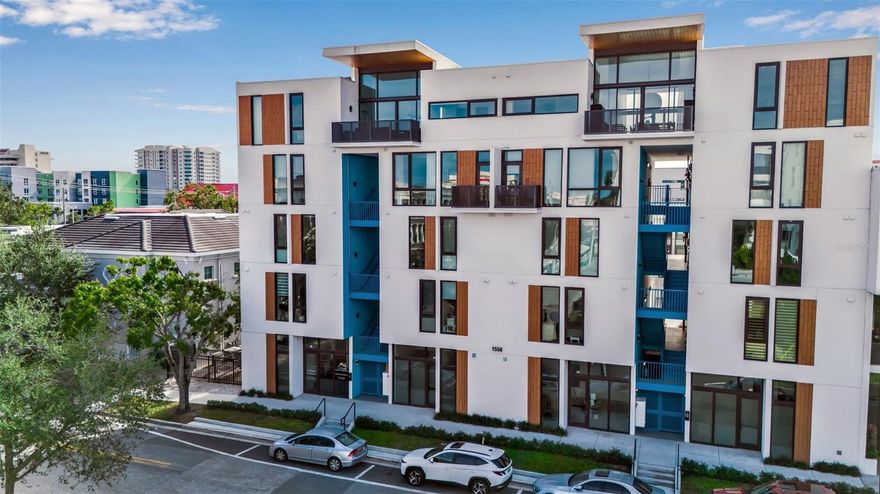 Experience exceptional downtown Sarasota living in Unit 208 at Zahrada 2—an architect-designed, new-construction condo that blends modern luxury, premium upgrades, and one of the most desirable locations in the Rosemary District. Designed by award-winning architects Halflants + Pichette, this contemporary two-bedroom loft-style residence is perfectly positioned near Sarasota’s most beloved restaurants, cafés, art galleries, theaters, and markets—plus Whole Foods, The Bay Sarasota, and the city’s best cultural venues. Just a short distance from the Saturday Farmers Market, Bayfront Park, Marina Jacks, Sarasota Opera, the Ballet, The Sarasota Modern, and the newly developed Bay Park, this home offers unmatched access to Sarasota’s vibrant urban lifestyle. For beach lovers, free trolley routes connect you to Lido Key and Siesta Key Beach, the #1 beach in the U.S. Inside, this beautifully crafted loft features soaring 12-foot ceilings and a dramatic wall of glass that fills the space with natural light. The split-level design enhances the modern aesthetic, while upgraded finishes create a true luxury living experience. The chef’s kitchen showcases sleek European slow-close cabinetry, quartz countertops, recessed lighting, and a stainless steel Frigidaire appliance suite. Ethernet ports in both bedrooms and the living room, fiber-optic WiFi, and Samsung Frame TV elevate both comfort and function. A rare highlight of this property is the large private outdoor terrace, surrounded by palm trees and maintained with an automatic irrigation system—a tranquil retreat ideal for relaxing or entertaining. Few downtown Sarasota condos offer outdoor living of this size and privacy. This residence is offered fully turnkey furnished, including all kitchenware, housewares, linens, bedding, towels, cleaning supplies, décor, and thoughtfully selected furnishings. The flexible second bedroom can be configured as a queen room, twin room with desk, or full office setup. A storage bed in the primary bedroom adds smart functionality. Additional upgrades include hurricane-impact windows and doors rated to 195 mph, block construction, porcelain tile flooring throughout, solid-core interior doors, Jack-and-Jill bathroom access, a powder room, washer/dryer, electronic Wi-Fi door locks and gate access, and fiber internet. Secure covered parking in the gated garage includes EV-charging prep so buyers may install a charger if desired. This property is truly “hands-off” for new owners. Housekeeping, landscaping, and AC maintenance can all transfer to the buyer for seamless continuity. Water is included in the HOA, reserves are fully funded, and the property has a proven rental history—earning approximately $6,000/month during high season—making it an exceptional option for investors seeking a 3-month, seasonal, or annual rental opportunity. Offering modern construction, premium upgrades, turnkey convenience, a private outdoor retreat, and a prime downtown Sarasota location close to The Bay Sarasota, this residence provides an elevated lifestyle that sets it apart.
Schedule your private showing today and discover why Unit 208 at Zahrada 2 stands out as one of the most compelling properties in the Rosemary District.