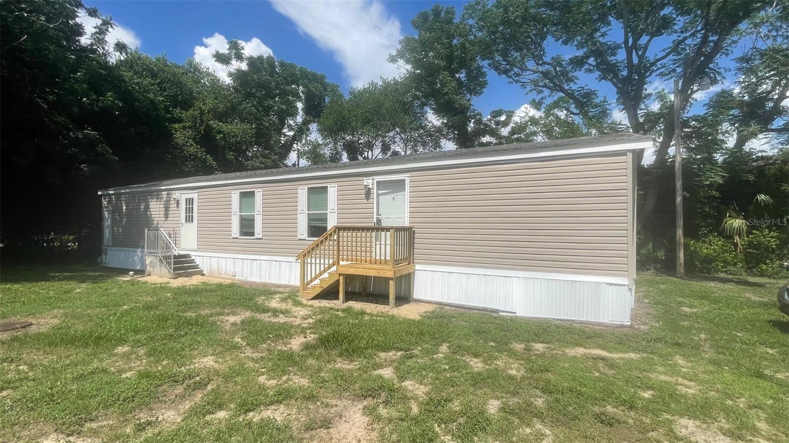 Great location, near The Villages! 2 bedroom/2 bathroom mobile home is located in a small Belleview mobile home park. It has a split plan, eat-in kitchen with lots of cabinets. Primary bedroom has walk-in closet and bathroom with walk-in shower. 2nd bath with tub/shower. Carpet and vinyl flooring. Rent includes water, septic, trash, and lawn maintenance. Appliances include a stove, microwave, and dishwasher. Schools: Belleview Elementary, Middle, and High. All applicants must view the property. All applicants over the age of 18 that will be residing in the property must submit an application and sign lease. Proof of income required $3,125 month. We work with low credit. Application fee is $125 1st adult and $50 each additional adult. NO PETS AND NO SMOKING. (Furniture not included)