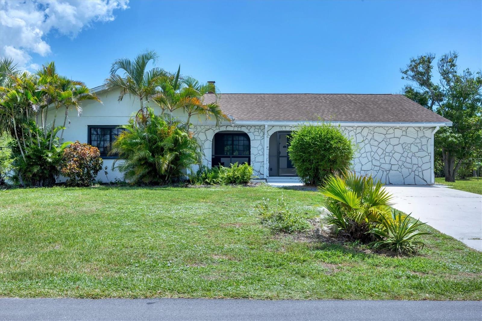 Your Florida home – with a sitcom legacy! Live where others vacation – in a home with Hollywood heritage. This charming single-family home in Englewood offers not only sunshine, beaches and space – but also a unique story: It was previously owned by Donald Martin, the son of Barney Martin – the actor who played Morty Seinfeld, Jerry's father on the legendary sitcom Seinfeld. So, take the chance and the rare opportunity to own a property that combines lifestyle, location and pop culture history. This three-bedroom, two-bathroom home sits on an expansive lot with lots of room for a pool and a tropical garden but you need to see the inside to appreciate this beautiful updated home. High ceiling, remodeled to a large open floor plan, a spacious kitchen that provides ample space of cabinets and counter space, tile flooring throughout the house, a striking wood-burning fireplace from the bottom to the ceiling, hurricane-rated windows, new screened-in front porch, large open deck in the fenced-in backyard. The garage was converted into a laundry room and a private gym. Beautifully furnished and decorated, this solid-built home with its timeless character is also a great home for an investment and comes with potential rental income. Peaceful location in Rock Creek Park, just minutes from pristine sandy beaches, breathtaking Gulf sunsets, shopping and historic Englewood's Dearborn Street, nature preserves, golf courses and the relaxed spirit of the Sunshine State – all just a short distance away. Whether you're looking for a primary residence, vacation retreat or smart investment, this home has everything it takes to become the star of your story. Schedule your showing today – before someone else takes the leading role.