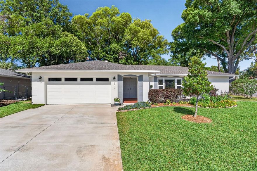 Welcome home to the Winter Park Pines where the trees line the streets and the mailman delivers to your door. This beautifully maintained 3-bedroom, 2-bathroom home offering 1,873 square feet of comfortable living in the highly desirable and serene Winter Park Pines community. This light-filled residence features a thoughtfully designed split floor plan with high ceilings, fresh interior paint (2026), skylights, and laminate and tile flooring throughout, creating a bright and inviting atmosphere from the moment you enter. The open living and dining areas are anchored by a charming wood-burning brick fireplace, while crown molding, ceiling fans, and French doors add both style and functionality throughout the home. The well-appointed kitchen includes white and gray cabinetry, stainless steel appliances, and a convenient pantry closet, perfect for both everyday living and entertaining. It flows seamlessly into the main living areas, making it easy to gather with family and friends. The spacious primary suite offers a private retreat, thoughtfully separated from the secondary bedrooms, and features a walk-in closet with custom built-ins, ceiling fan, and French doors leading to the expansive and shaded backyard. The renovated en-suite bathroom showcases double vanities and a beautifully tiled shower with frameless glass enclosure. The secondary bedrooms are well-sized and versatile, with easy access to the renovated hall bathroom featuring a granite double vanity, navy cabinetry, and direct access to the backyard, ideal for indoor-outdoor living. Step outside to enjoy a fully fenced, landscaped backyard situated on a generous .22-acre lot. The expansive patio with terracotta tile flooring provides the perfect space for outdoor dining, entertaining, or simply relaxing in a private setting. Additional highlights include a two-car garage and a Ring home security and surveillance system for added peace of mind. Located just minutes from top-rated Winter Park schools, the Cady Way Trail, Winter Park Pines Golf Course, Advent Health Winter Park campus, Crosby Wellness Center and a variety of shopping and dining options, this home offers both tranquility and convenience. Residents also enjoy access to nearby community amenities including a pool, playground, beach volley ball courts and tennis/pickleball courts. With close proximity to major roadways, downtown Winter Park, and Orlando International Airport, this property truly combines comfort, location, and lifestyle. Don’t miss the opportunity to make this exceptional home yours in one of Winter Park’s most sought-after neighborhoods. Roof 2020, HVAC 2022, Electric and Plumbing 2014, Water Heater 2021.