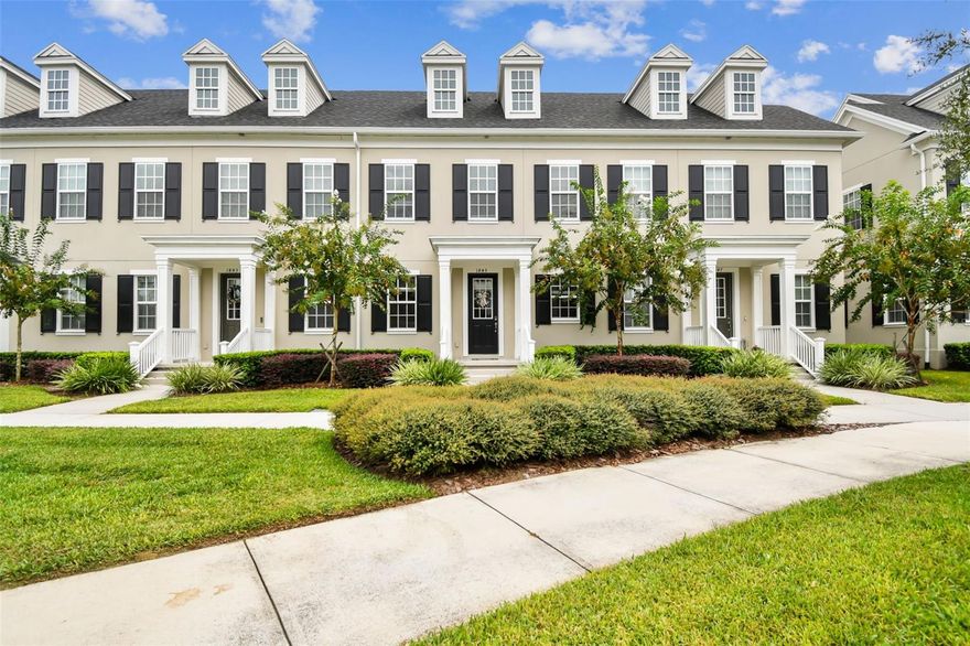 Enter timeless style and modern comfort with this colonial-inspired FULLY FURNISHED townhome overlooking the park, nestled in Celebration's newest community, Island Village. Go inside to discover real hardwood floors, a beautifully crafted staircase with iron balusters, custom window molding, floating shelves and cabinetry, all enhanced by soaring ceilings and recessed lighting. The open-concept design is ideal for entertaining, complete with a custom-built entertainment center offering ample storage. The chef's kitchen is a true showpiece, featuring 42-inch espresso shaker cabinets with brushed nickel hardware, Caesarstone quartz countertops, a single-basin stainless sink with gooseneck faucet, a cream-glazed subway tile backsplash, and under-cabinet lighting. A stainless-steel GAS cooktop, oven, vented microwave, dishwasher, and refrigerator complete the sleek design. Natural light floods the dining area, where sliding glass doors open to a private patio courtyard with herringbone brick pavers. Indulge in refined Florida living with a retractable screened patio, offering a seamless indoor-outdoor retreat for every season.