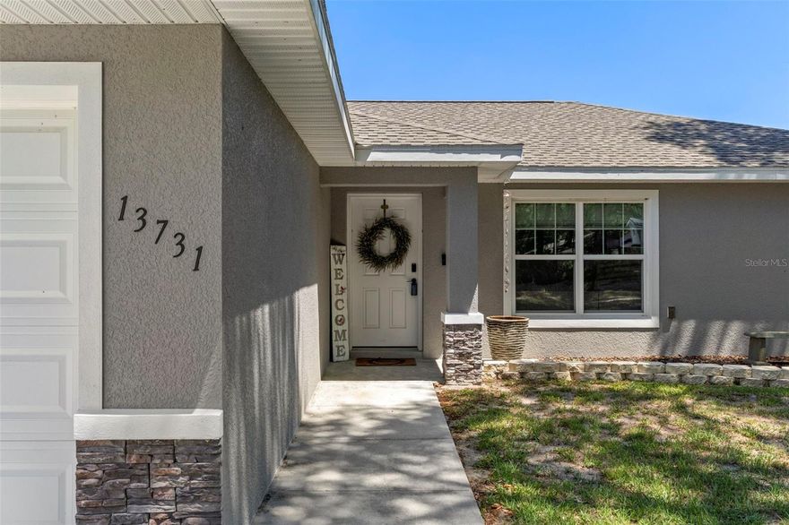Welcome to a newer home built in 2023 with all the upgrades already added. This charming residence is nestled in a serene rural setting, offering tranquility and natural beauty. The property features three spacious bedrooms and two modern bathrooms, perfect for a family living. The open-concept area boasts ample light, creating a warm and inviting atmosphere.  The home includes newly installed black-out shades, granite counter tops, stainless steel appliances, Samsung Washer/Dryer, and a Culligan water filtration system throughout the entire house along with reverse osmosis drinking spout at kitchen sink. Enjoy a large backyard with newly installed PVC privacy fence and a Pergola on back porch, ideal for outdoor activities and gatherings. Don't miss the chance to experience peaceful country living while being just minutes away from local amenities, such as the Rainbow Springs, World Equestrian Center and Crystal River, where you can swim with the manatees.