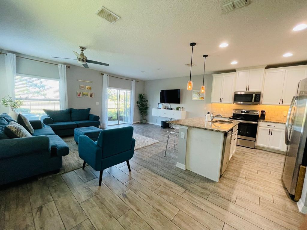 Photo of 1301 Flowing Tide Drive, Orlando, FL 32828 (MLS # O6400859)