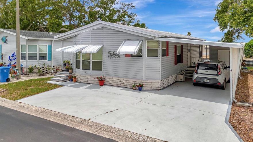 Welcome home to Caribbean Isles Residential Cooperative, a friendly and highly sought-after 55+ waterfront community where neighbors become friends and every day feels like a getaway. Located on the desirable Harbor Side (east side of the community), this spacious 2-bedroom, 2-bath home features new carpet throughout, an abundance of windows that fill the home with natural light, and vaulted ceilings that create an open, airy feel. This home is truly move-in ready.

 The large eat-in kitchen is ideal for everyday living and casual gatherings. The primary bedroom offers a peaceful retreat with a generous walk-in closet and a private ensuite bath. A convenient indoor laundry/mud room adds extra functionality and storage.
Step outside and step right aboard your boat. This beautifully maintained home sits along the Saint Georges Canal, offering tranquil water views and the occasional delight of watching manatees and dolphins from your backyard. Outdoor living is where this home truly shines. Enjoy your morning coffee in the screened patio, spend quiet afternoons watching the water, or unwind in the evening on the covered open patio while taking in stunning sunset skies.

Life at Caribbean Isles is all about the perfect balance of activity and relaxation. Residents enjoy kayak and boat launches with a scenic canal system leading directly to Tampa Bay. Friendly games of bocce ball, shuffleboard, and horseshoes are always nearby, along with a heated community pool open year-round. The clubhouse is the heart of the community, featuring a craft room and a spacious game room with pool tables, card tables, indoor bar shuffleboard, and darts. With a full calendar of social activities, from themed dinners and dances to community gatherings there’s always something to look forward to.

Ideally located between Tampa and Sarasota/Bradenton, Caribbean Isles offers easy access to beaches, dining, shopping, and entertainment. Come visit, relax, and see for yourself why so many are proud to call Caribbean Isles home.