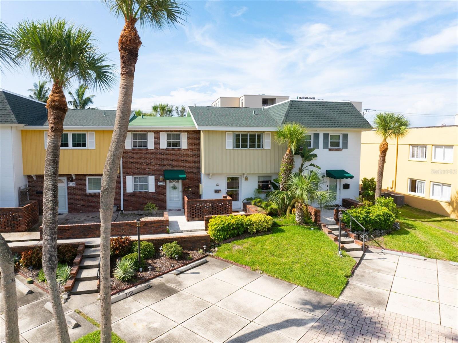 It is all about the location! Welcome to Venice Town House, a charming townhome community just steps from Venice Public Beach and an easy stroll to Historic Downtown Venice. This unique 13-unit community is across the street from Heritage Park and offers lifestyle options not available in most condominium communities; you can garden, grill on your own BBQ, and enjoy a pet-friendly environment (HOA review and approval required). This 2-bedroom, 1 full and 2 half bath home offers 1,246 sqft of comfort, perfect for a full-time residence, a seasonal getaway, or an investment property (1 month minimum rental). The large, screened lanai, outdoor patio, and sanctuary courtyard in the back (that is a surprise to most!) provide a tranquil setting for outdoor living. You will love the over-sized living room and primary bedroom, with its long wall of closet space, ensuite half bath and balcony overlooking the courtyard. The guest bedroom also boasts above average closet space with its walk-in closet and separate storage nook. Recent updates include a new water heater (2025), A/C (2024), and roof (2022). Residents at Venice Town House love the walkability it affords. You are a few blocks to Venice’s picturesque downtown and its diverse dining, boutique shopping, entertainment options, and regular slate of festivals/events. The weekly Farmer’s Market, tennis/pickleball/ shuffleboard/basketball courts at Hecksher Park, Venice Library, Venice Art Center, and Venice Community Center are also all within walking distance. And best of all, Venice Public Beach is only a two-minute walk, perfect for sunsets, beachcombing, yoga on the beach, or listening to the regular evening music jams under the Pavilion. See why life on Venice Island is so special! Schedule your showing today!