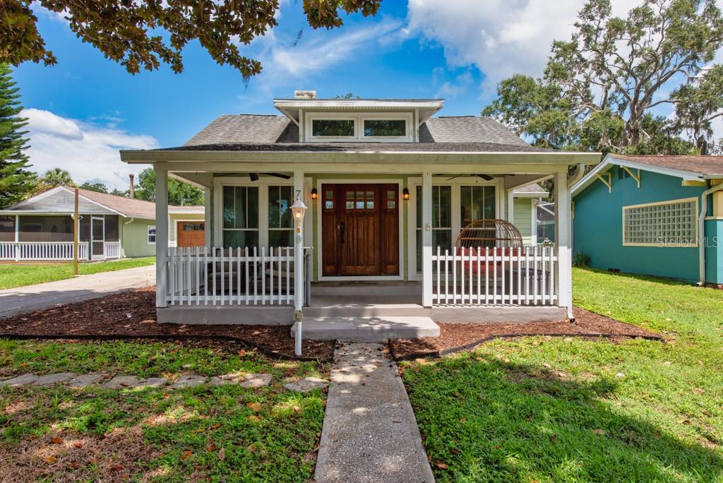 Step into timeless elegance with this 1924 bungalow offering direct Gulf access and old Florida charm in one of the most picturesque pockets of the Cotee River. With 3 bedrooms, 3 bathrooms, and nearly 1,900 square feet of living space, this unique home is loaded with character and modern conveniences. Across the street, you'll find your private dock complete with an electric boat lift—ideal for launching into deep water adventures or soaking up serene river views. Cruise straight to the Gulf, or head just minutes away to the vibrant heart of downtown New Port Richey. Golf cart-friendly streets add to the neighborhood's inviting, laid-back vibe. Inside, you’ll find a blend of original craftsmanship and thoughtful updates. The sun-drenched front porch and oversized sunroom offer a warm welcome, while the original hardwood floors, vintage trim work, and generous room sizes preserve the home’s historic charm. The large upstairs loft with a full bathroom offers versatile space for guests, a studio, or a private retreat. The remodeled hall bathroom, hurricane-impact windows throughout, stainless steel appliances, and an oversized utility room add modern touches and everyday comfort. There’s no shortage of storage here, including a spacious 2-car garage and ample closet space throughout the home. Out back, a fully fenced yard provides privacy and space to unwind, entertain, or garden. Best of all—no HOA and no flooding or damage reported. Imagine mornings on the river, evenings on the porch, and weekends by golf cart—this home offers a lifestyle that’s as laid-back as it is luxurious. Don't miss the rare opportunity; call now and schedule your showing today!