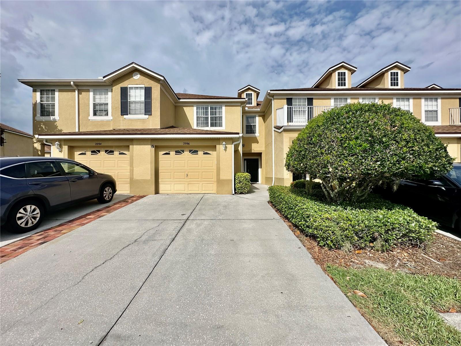 Welcome to this charming three bedroom, two and a half bathrooms townhouse. Beautiful house in the gated community of Townhomes of Flora Ridge. Downstairs big living room in an open space connected to the kitchen. One attached car garage. Back covered porch with enclosed screen where you can have your barbecue. Downstairs there is a half bathroom. Upstairs, there is a large Master Bedroom with tray ceiling, 2 closets, master bath with double sinks, another 2 bedrooms with a full bath and a built-in office space. Also, a big storage through the Lanai. The community amenities include pool, playground, nice walking trails with a beautiful view of the lake from the 2 bedrooms upstairs, waste station for your convenience when walking your pets. Exceptional location, just 2 minutes to The Loop Mall, 5 minutes to Crosslands Mall, a bunch of restaurants, supermarkets and much more. Located just close to Osceola Pkwy, John Young Pkwy, I-4, SR 417 and also the road of Florida Turnpike. Fast access to Orlando International Airport, 15 minutes from Disney Parks.