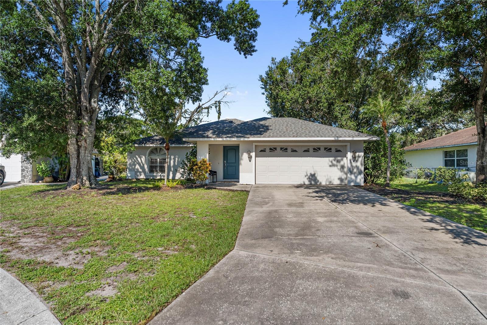 One or more photo(s) has been virtually staged. This beautifully remodeled 4-bedroom, 2-bathroom home in Sarasota’s Deer Hollow community offers the perfect balance of modern style, comfort, and convenience. From the moment you step inside, you’ll notice the light-filled open layout with soaring vaulted ceilings and a seamless flow between the living, dining, and kitchen areas. The main living spaces are finished with tile designed to look like natural hardwood, offering both style and long-lasting durability. While plush carpet in the bedrooms and tile in the bathrooms provide comfort and functionality throughout. At the heart of the home, the custom kitchen is a true showpiece designed for both cooking and entertaining, with bright white shaker cabinets accented by glass fronts, granite countertops, stainless-steel appliances, and an oversized island with bar seating. The dining room just off the kitchen offers plenty of space for family dinners and opens to the backyard for effortless indoor-outdoor living. The primary suite provides a private retreat, while the updated bathrooms showcase modern tile, vanities, and fixtures with a spa-like feel. Three additional bedrooms offer flexibility for family, guests, or a home office. Practical updates include a roof replaced in 2019, an A/C system installed in 2013, and a hot water heater from 2016, giving buyers peace of mind. Located in the desirable Deer Hollow community, residents enjoy tree-lined streets, walking trails, and a playground with low HOA fees and no CDD costs, all just minutes to the UTC Mall, Benderson Park, and a variety of shopping, dining, and entertainment. When it’s time for a beach day, Sarasota’s world-famous Gulf beaches are only a short drive away, making this thoughtfully updated, move-in ready home a rare find for those seeking the very best of Sarasota living.