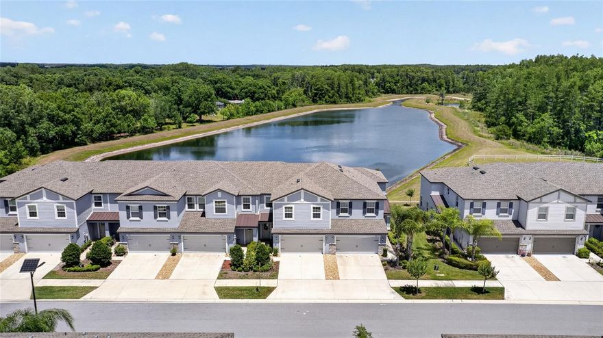A rare opportunity to own a beautifully upgraded, like-new 2022 Lennar townhome featuring the sought-after Marisol floor plan, offering a premium conservation setting with water views and low-maintenance living in the highly desirable Townes at Cypress Ranch in Lutz, walking distance to highly sought-after Skybrooke K-8. Set on a private homesite with no rear neighbors, this spacious 3-bedroom, 2.5-bath, 2-car garage residence spans an impressive 2,319 sq ft of thoughtfully designed living space with block construction on both the first and second floors. The open-concept layout is enhanced by wide plank porcelain tile and luxury vinyl flooring throughout—no carpet—creating a clean, modern aesthetic that is both stylish and easy to maintain. The kitchen is a culinary enthusiast’s dream, featuring 42” cabinets embellished with crown molding, gleaming quartz countertops, stainless Samsung Smart appliances, and an oversized island—ideal for both everyday living and entertaining. The main living area is filled with natural light and seamlessly connects to the patio, creating a bright and inviting space. Enjoy a peaceful conservation setting with water views from the backyard and no rear neighbors, offering both privacy and a serene natural backdrop. From the patio, take in glimpses of the water while spotting native birds, deer, and occasional wildlife, creating a unique connection to nature that enhances everyday living. Whether starting your day or unwinding in the evening, the setting provides a rare sense of calm. Upstairs, a versatile loft offers flexible living space, while the spacious primary suite serves as a private retreat with a custom walk-in closet, dual vanities, and a glass-enclosed shower. Two additional bedrooms are generously sized with ample closet space. The laundry room includes added cabinetry for convenience and organization. This home is loaded with valuable upgrades, including a whole-house water conditioning system, security system, second-floor impact windows, storm panels, and an insulated garage door, along with enhanced storage features that add everyday functionality. Enjoy true low-maintenance living with predictable monthly expenses—the HOA includes exterior insurance, water, lawn care, and landscaping, and there is NO CDD fee. Residents enjoy walking trails, green spaces, and park areas within a peaceful, well-maintained setting. Location is exceptional—walking distance to Skybrooke K-8, with convenient access to ALDI, Publix, a variety of dining options, and everyday essentials. Nearby shopping destinations such as Tampa Premium Outlets, The Shops at Wiregrass, along with close proximity to top medical facilities, St. Joseph’s Hospital-North and AdventHealth Wesley Chapel, enhance the overall lifestyle. Commuting is effortless with quick connections to the Suncoast Parkway, SR-54, US-41, and Dale Mabry Highway. Where location, lifestyle, and low-maintenance living come together—this home delivers on every level. Schedule your private showing today.