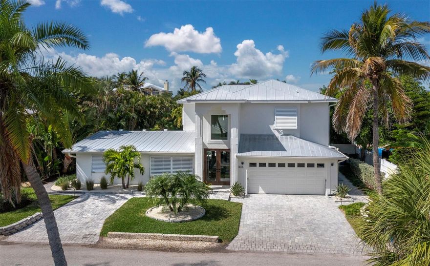 Come savor laid-back luxury and the island lifestyle that Longboat Key is known for in this tranquil, seaside retreat. This home is a decorators dream! Completely remodeled with a brand new kitchen, all new flooring,
4 bedrooms and 3 baths in an open and inviting space. The line is blurred between indoor and outdoor living with a gorgeous sparkling pool just beyond the mahogany French doors, surrounded by tropical plants and situated on a fabulous canal. For the boaters, you have a 14,000 lb. lift and no fixed bridges to the Gulf of Mexico, making your day on the water an easy experience. Nightly sunsets at the neighborhood beach is just a short walk away and something to make a regular habit of! A short distance to multiple restaurants, shopping, 12 miles of biking paths, and the incredible Joan Durante Park on the Bay only add to the remarkable quality of life living on an island can provide. When you’re ready for something more, St.Armands Circle and the cultural mecca of Downtown Sarasota is just a short drive away. This extraordinary home is a true island paradise you must come see.