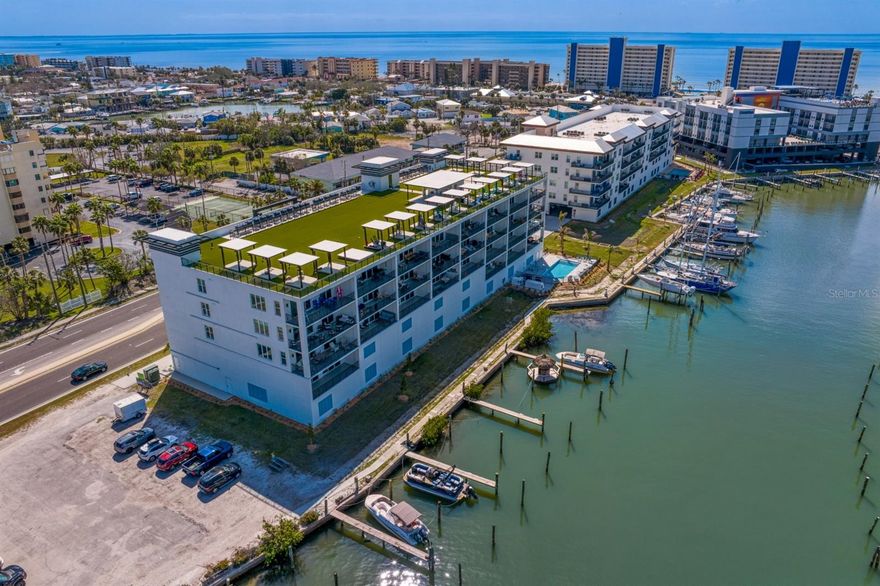 One or more photo(s) has been virtually staged. Discover the ease of coastal living in the heart of Madeira Beach. From morning walks along the shoreline to sunsets over the Gulf, The Residences at Madeira Beach Town Center offer an 
effortless blend of beachside relaxation and modern design. Stroll to local dining, boutique shopping, or the nearby Beachmaker Resort by Marriott — everything you love about Florida living is just outside your door.
Closeout incentives available for rate buy down, closing costs, furniture credit, prepaid condo dues, or boat slip prepayments, in any combination preferred.

This never-lived-in three-bedroom, three-bath condo features nearly 2,000 square feet of open living space and a welcoming double-door entry with a spacious foyer. Finishes include quartz countertops, GE Café appliances, Moen fixtures, LVP flooring, and impact-rated windows and doors. Community amenities include a heated pool, hot tub, fitness center, community kitchen, rooftop terrace, and assigned parking with EV capability. Pet friendly with no size restrictions and 30-day minimum rentals permitted.