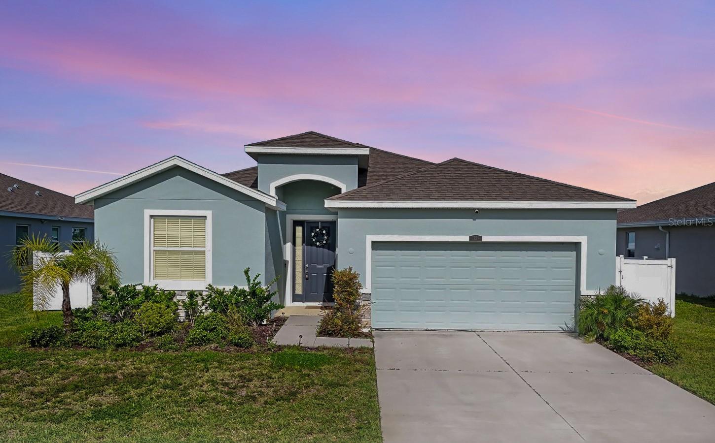 One or more photo(s) has been virtually staged. Step into a move-in ready home that checks all the boxes for modern Florida living! Built in 2021, this 4-bedroom, 2.5-bath beauty offers the perfect blend of style, comfort, and smart design.
This home is located outside of flood and evacuation zones for added peace of mind!
The open-concept layout features a spacious great room with cool tile flooring and abundant natural light, creating a welcoming atmosphere from the moment you walk in. The upgraded kitchen is both chic and functional, complete with a large granite island, stainless steel appliances, sleek subway tile backsplash, and a walk-in pantry to keep everything in order. Whether you're hosting friends or enjoying a quiet night in, this kitchen is ready to impress.
The split-bedroom floor plan offers added privacy, with a generous primary suite tucked away in the back of the home. You'll love the tray ceiling, TWO walk-in closets, and spa-like en-suite featuring dual sinks, a soaking tub for evening relaxation, and a large rain shower. Plush carpet in the bedrooms adds warmth, while ceiling fans in every room and two fans on the screened lanai keep you cool year-round. Enjoy your morning coffee or evening unwind in the screened lanai, overlooking the fully fenced backyard!
Two-car garage for parking and storage has a remote opener for convenience. PLUS this community adds even more value with its resort-style pool, playground, and dog park, making it easy to enjoy the Florida lifestyle. Don’t wait—your next chapter starts here!