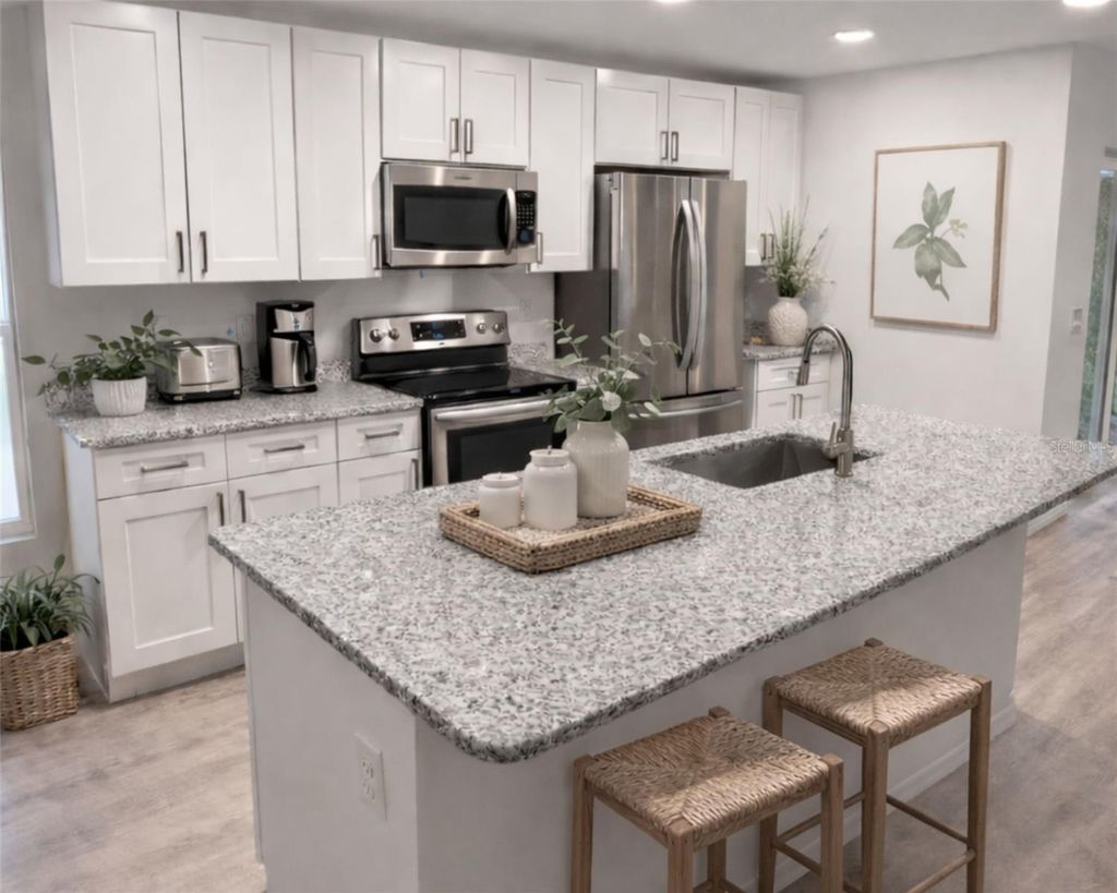 Photo of 1003 Avenue A, Haines City, FL 33844 (MLS # L4960205)