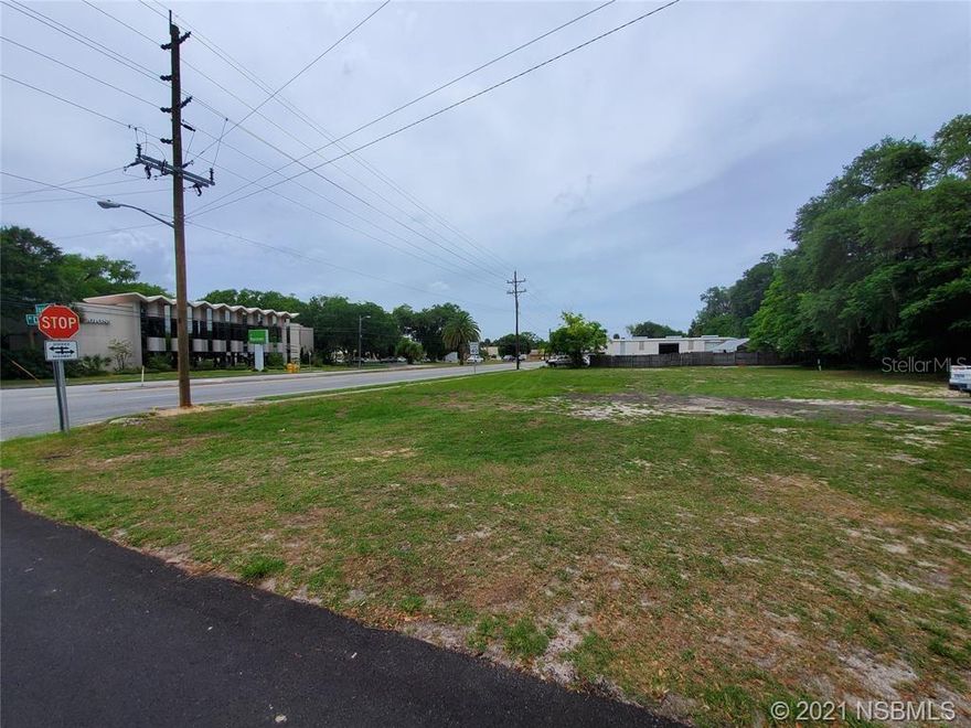 Cleared, commercial lot on high traffic corner with 150 feet of frontage directly on North Dixie Freeway (US1). Property is zoned B-3 which allows for many options. Seller has completed over $30,000.00 worth of site planning on the property which can be handed over to the new owner. Impressive drive-by traffic lends to ample visual exposure. Site is ready for development and close to downtown New Smyrna Beach, Port Orange and other active areas of commerce.; Cleared: Partial ;Water: Available at Site