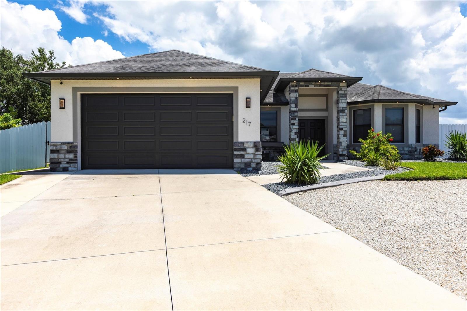 Incredible value in the heart of Cape Coral! This well-maintained 3-bedroom, 2-bath pool home offers nearly 1,800 sq ft of living space on an oversized 0.36-acre lot and is priced below market value—perfect for a primary residence, vacation home, or investment. Built in 2017, the home features a split-bedroom floor plan, tray ceilings, built-in closet cabinetry, dual sinks, a soaking tub, separate shower, impact windows and doors, and an open-concept kitchen with eat-in dining. The spacious main suite is privately tucked away and offers direct access to the outdoor space. Step outside to a fully fenced backyard oasis with a heated in-ground pool and spa, outdoor kitchen, grill, fire pit, lush landscaping, and an additional outbuilding for storage or hobbies. A 2-car attached garage with epoxy floors and an extended driveway adds convenience and curb appeal. Located west-facing on a quiet street with no HOA and no rental restrictions, this home sits just minutes from Pine Island Rd, Veterans Parkway, schools, parks, dining, and shopping. Cape Coral continues to grow rapidly, with new developments, restaurants, and retail expanding all around you. Enjoy quick access to Fort Myers, downtown Cape Coral, golf courses, and the Gulf beaches. Whether you're relaxing poolside, hosting guests in your outdoor kitchen, or exploring everything SWFL has to offer, this home delivers the ideal Florida lifestyle—at an unbeatable price.