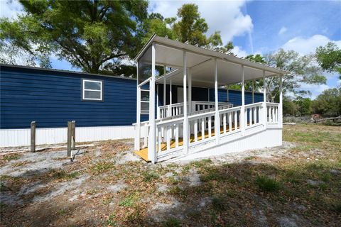 Photo of 7457 NE Highway 349, Old Town, FL 32680 (MLS # S5147547)
