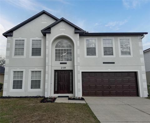 Photo of 2109 Aitkin Loop, Leesburg, FL 34748 (MLS # O6389384)