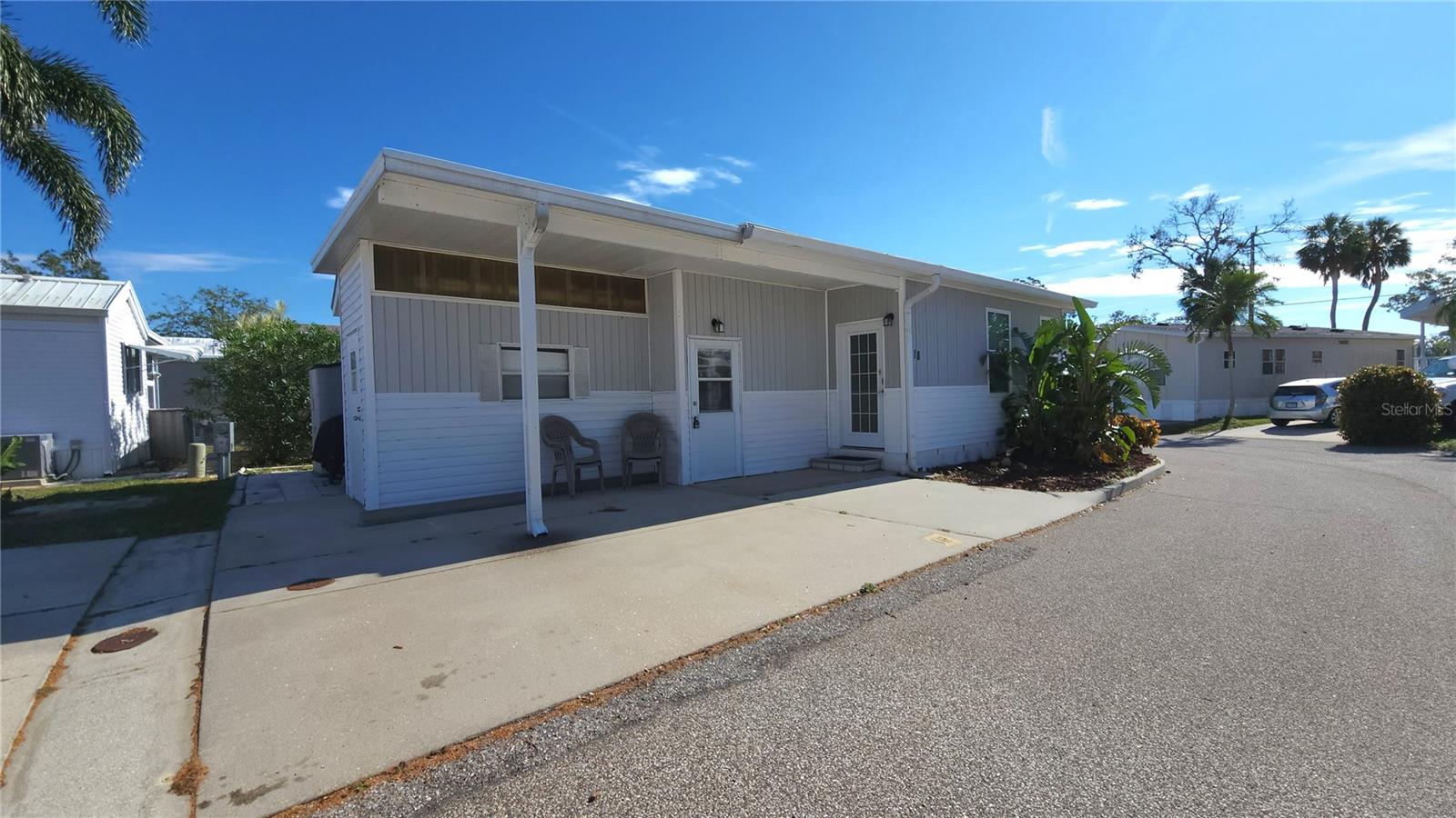 PRICE IMPROVEMENT ON THIS WELL KEPT TWO BEDROOM, 1 1/2 BATH MOBILE HOME IN ACTIVE 55+ COMMUNITY. PET FRIENDLY! Come and enjoy the Florida sunshine in a friendly community. This furnished, turn-key home is move-in ready! Lovely living room with a great connection to the dining room. The efficient kitchen has newer countertops and a Bosch dishwasher. The primary bedroom has plenty of built-in storage. Second bedroom has an en suite half bath with laundry. There is a workshop in the attached shed, a golf cart parking spot in the front, updated plumbing, & membrane roofover. Central A/C (2017). Sold for CASH ONLY with right to inspect. SUGAR CREEK COUNTRY CLUB has low HOA fees of just $525.00/quarter which includes water, sewer, trash, basic cable, internet, and lawn mowing. The community has two swimming pools, heated spa, clubhouse, shuffleboard, tennis, pickleball, and an active social calendar during the winter months. SO MUCH TO OFFER!