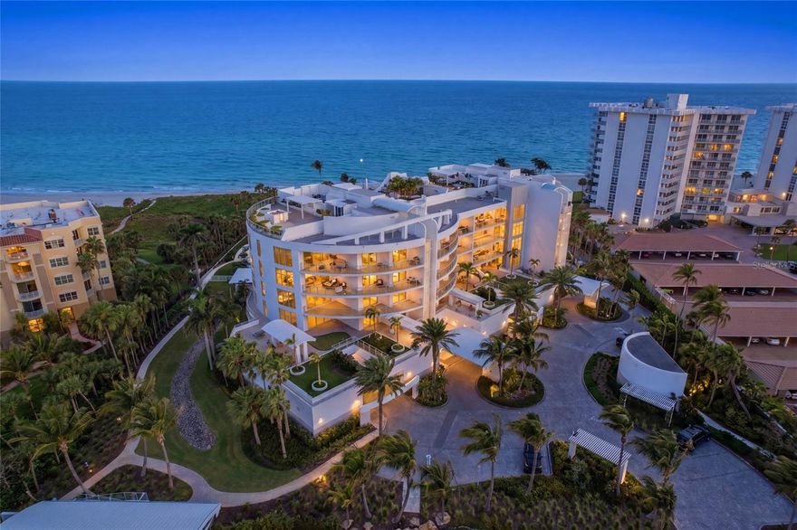 One or more photo(s) has been virtually staged. Welcome to an exceptional Gulf-front residence within the prestigious Aria community on the coveted south end of Longboat Key where refined coastal living meets timeless elegance. Set along 300 feet of pristine private shoreline, this extraordinary property offers a rare opportunity to experience true beachfront luxury in one of Sarasota’s most exclusive enclaves.
Beyond the gated entrance, Aria unveils a serene, resort-inspired setting with lush native landscaping, tranquil walking paths, and the historic Villa am Meer, a beautifully restored 1935 seaside mansion that serves as the community’s elegant social centerpiece.
This impeccably designed residence spans nearly 4,000 square feet and is accessed via a private elevator, opening to a grand foyer and expansive, light-filled interiors. The thoughtfully curated open-concept floor plan seamlessly integrates sophisticated living and dining spaces with a chef’s kitchen, creating an ideal environment for both everyday living and elevated entertaining.
Walls of floor-to-ceiling glass and soaring ceilings invite natural light while framing sweeping, unobstructed views of the Gulf. Expansive wraparound terraces provide the perfect setting to enjoy breathtaking sunsets and coastal breezes from nearly every room.
The gourmet kitchen is a statement of both form and function, featuring premium quartz surfaces, custom wood cabinetry, and top-tier appliances by Wolf and Miele. The primary suite serves as a private sanctuary, offering a spa-inspired retreat with dual baths connected by an oversized walk-in shower an exceptional design element rarely found.
Two additional ensuite bedrooms provide luxurious accommodations for guests, while a dedicated office or optional fourth bedroom adds versatility. A bonus room offers additional flexibility for hobbies, media, or storage.
Residents of Aria enjoy an unparalleled suite of amenities, including a beachfront pool and spa, state-of-the-art fitness and yoga studios, massage room, and a private wine cellar. A full-time onsite caretaker ensures a seamless, service-oriented lifestyle. The residence also includes a private, oversized two-car dehumidified garage.