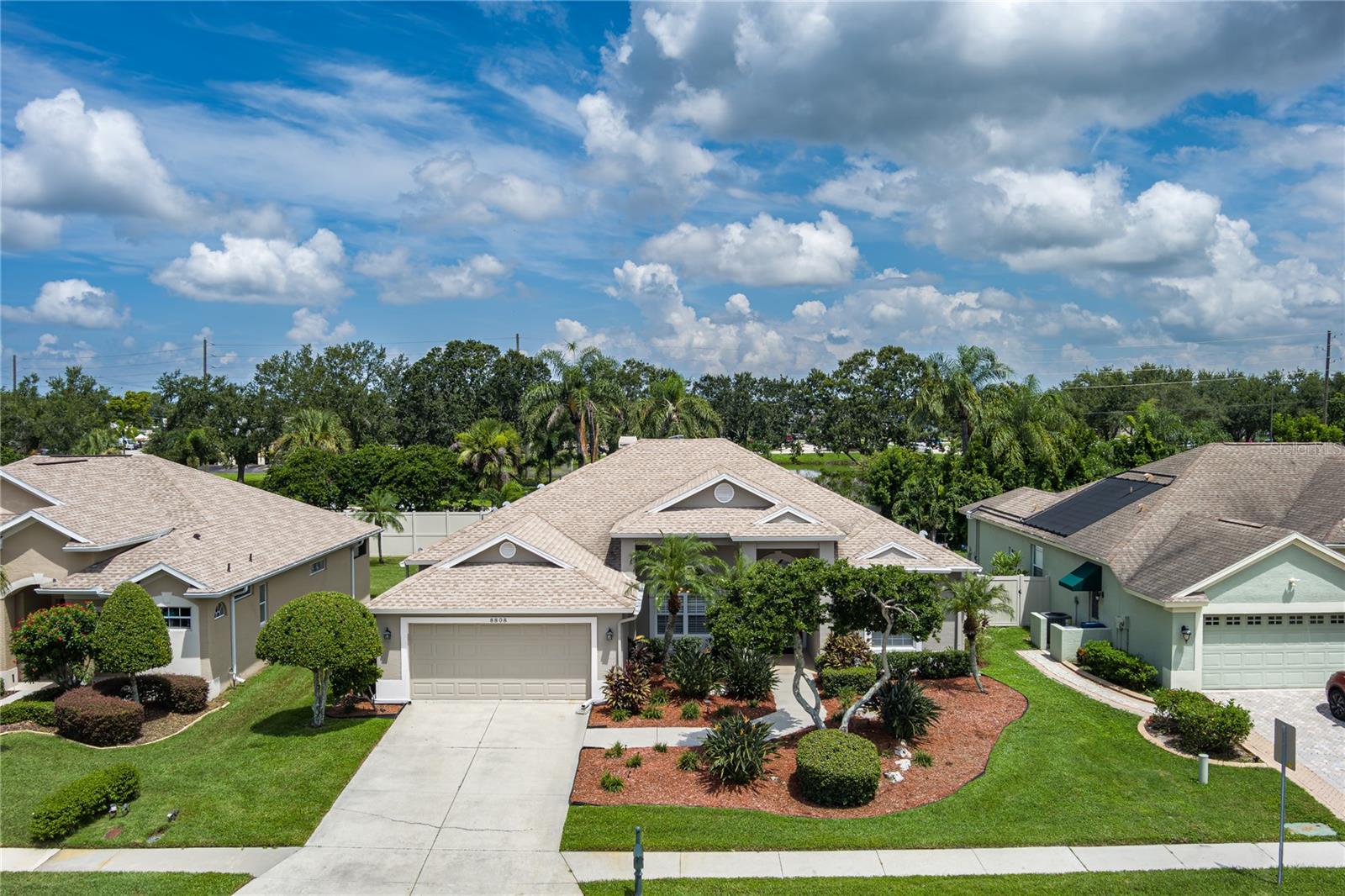 Your private Florida oasis awaits! Step into resort-style living with a heated pool and spa, spacious screened lanai, and a fully fenced backyard—perfect for relaxing, entertaining, or soaking up the sun year-round.
Nestled in the sought-after Parkwood Lakes community, this beautifully maintained home reflects true pride of ownership. You’ll love the quiet streets, well-kept homes, and easy access to shopping, dining, and a variety of nearby medical offices and clinics.
Recent upgrades bring peace of mind and added value, including a new roof (2020), new AC (2020), and a garage door rated for 145 mph winds.
Inside, this 3-bedroom, 2-bath home offers 2,158 sq ft of well-designed space with crown molding, arched doorways, and vaulted ceilings. The chef’s kitchen features stainless steel appliances, granite countertops, a tile backsplash, breakfast bar, and a sunny café nook overlooking the pool. The open floor plan connects the kitchen to a spacious family room with built-ins, a cozy fireplace, and pocketing sliders for seamless indoor-outdoor living.
The split-bedroom layout ensures privacy, with a large primary suite offering lanai access, a walk-in closet, and a spa-like bathroom complete with granite dual vanities, a garden tub, and separate shower.
Parrish is a beautiful and growing community, and this home puts you just a short drive from the Gulf beaches, Sarasota’s vibrant arts scene, and within easy reach of Tampa, St. Pete, and Clearwater—combining style, comfort, and an unbeatable location.