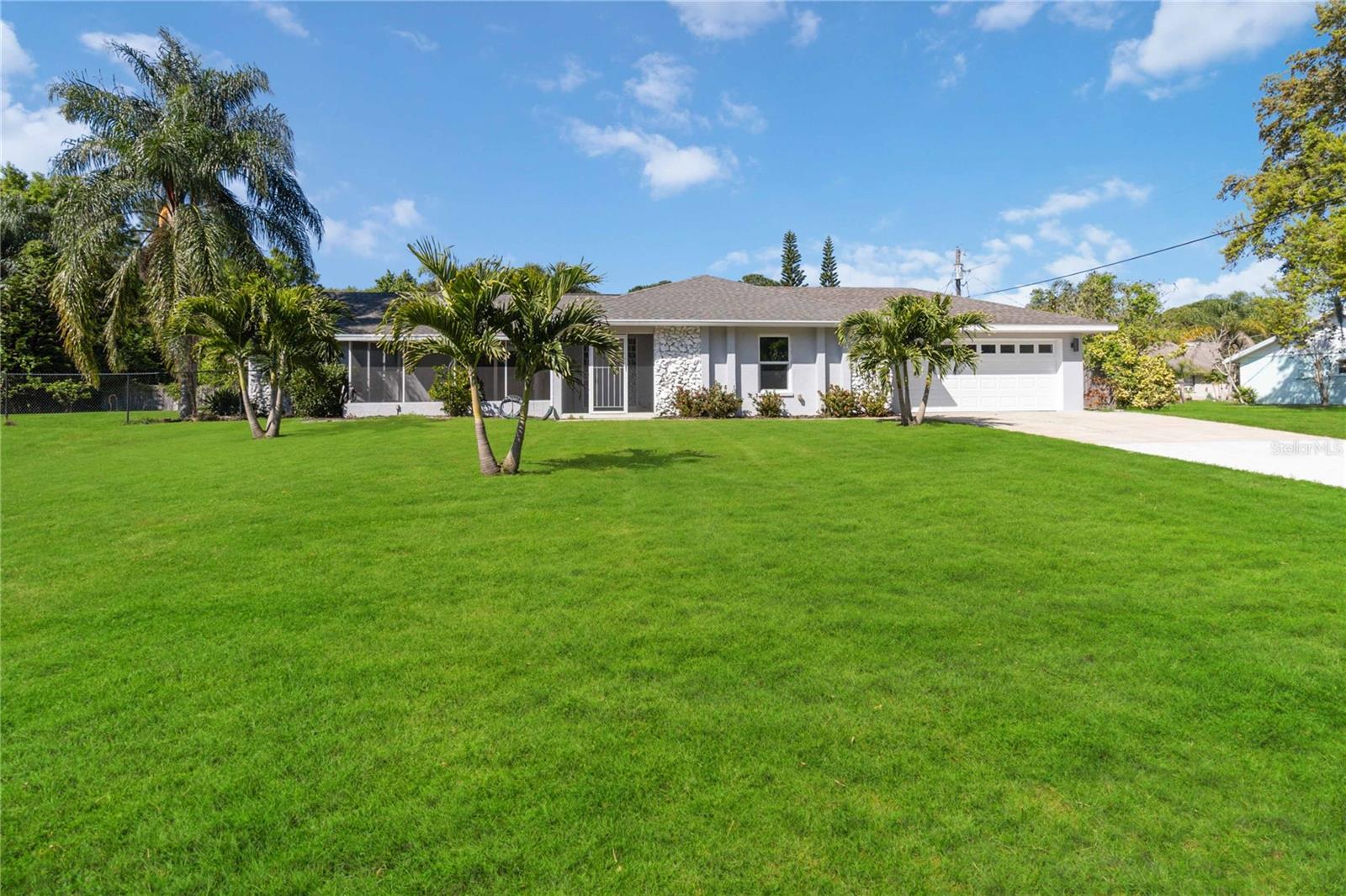 Welcome to this well-maintained 4-bedroom, 2-bath home located in the heart of North Merritt Island on a spacious lot. This split floor plan offers vaulted ceilings and an open living area filled with natural light, thanks to impact-rated windows and hurricane sliders installed in 2017. A convenient wet bar enhances the living space, perfect for entertaining. Step outside to an open-air patio and a large pool—ideal for relaxing or hosting guests. The property also features a 2017-installed septic system, a 2-car garage with ample room for a workbench and extra storage, and a whole-house Generac generator for peace of mind. This home has been thoughtfully upgraded and lovingly maintained—a true gem in a sought-after neighborhood. Premium Home Warranty included!