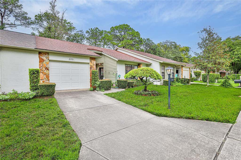Photo of 6591 Brambleleaf Drive, Spring Hill, FL 34606 (MLS # W7888045)