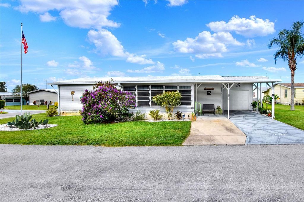 Photo of 6388 Lolly Bay Loop NE, Winter Haven, FL 33881 (MLS # P4936387)