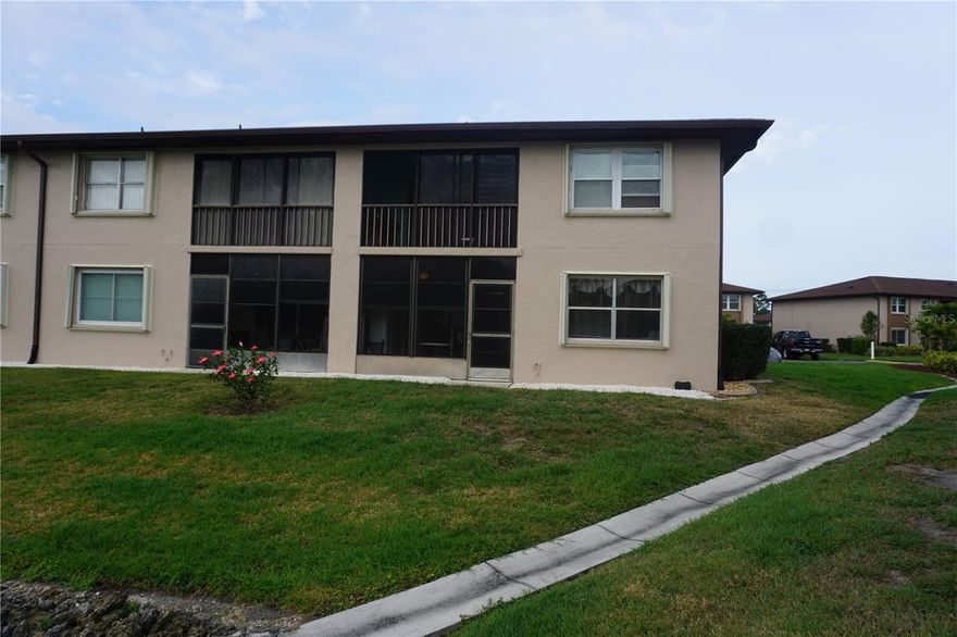 FIRST FLOOR UNIT!  Stop by and see this great 2 bedroom 2 bath condo located in a great spot.  You will enjoy the location right by the lake, with beautiful views from the Lanai.  Ample parking for you and your guests, and there is no smoking allowed in the entire complex.

Worry-Free Living: Each unit comes with hurricane shutters, and the condo fee covers virtually everything outside, including water/sewer, pest control, exterior maintenance, public insurance, and professional on-site management. A large reserve fund ensures future stability.
Amenities Galore: Stay active with a heated pool, tennis courts, shuffleboard, and a fully-equipped clubhouse.
Prime Location: Enjoy beautifully manicured grounds and easy access to local conveniences, with golfing just 7 minutes away, plus nearby shopping, Walmart, and churches.