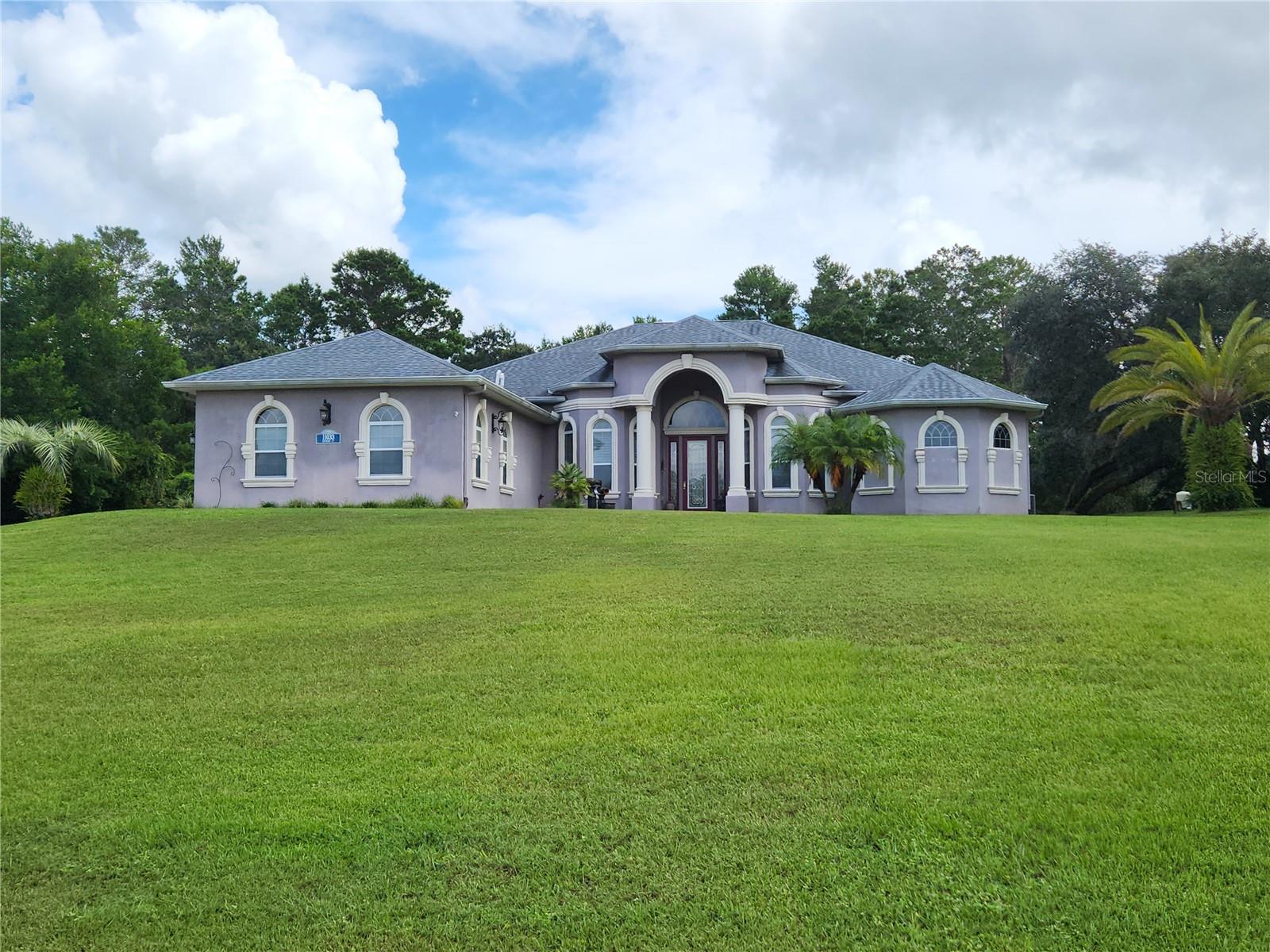 Woodland Water 3 Bedroom Executive Pool Home On Over 1 Acre Of Land On A Cul-De-Sac- 3.5 Bathrooms And A Screened 3 Car Garage- Enter The Home To The Great Room With A Tray Ceiling- Formal Dining Room With Plantation Shutters- Both Rooms Have Wood Flooring- And A Separate Office Room- The Large Eat In Kitchen Has A Walk In Pantry, Breakfast Bar, Dual Sinks, Quartz Counter Tops, Center Island With A Wine Cooler And A Dining Nook- The Master Bedroom Has 2 Walk In Closets, Jetted Garden Tub, Separate Shower With Dual Heads, Bidet, Linen Closet, Quartz Counter Tops And Plantation Shutters- There Is A Oversize Porch And A Separate Cabana Style Room For Entertaining With A Full Kitchen With A Breakfast Bar, Gas Stove Large Sink And Other Kitchen Appliances, Tray Ceiling, Ceiling Fans, Recessed Lighting, Granite Counter Tops And Wall Cabinets- Extras Include- Cabana Roof 2014, 2 septic systems, one for the house 1 for the cabana, Shed 2014, Tankless Water Heater, Auto Screen For The Garage, Paver Drive And Walk Way, Transom Windows, Interior Paneled Doors, Propane Gas Stove And Water Heater, Guest Bathroom With A Bidet, Inside laundry Room With An Ironing Board, Wall Cabinets And A Wash Tub, Attic Storage, Irrigation Well, Termite Traps In The Yard, 1/2 Bath With A Wash Tub In The Garage, 3rd. Bedroom Has A Closet Organizer, Solar Tube In The Guest Bath- Much More- Call Today For A Showing. Repaired Sinkhole Home. Full Docs Available.