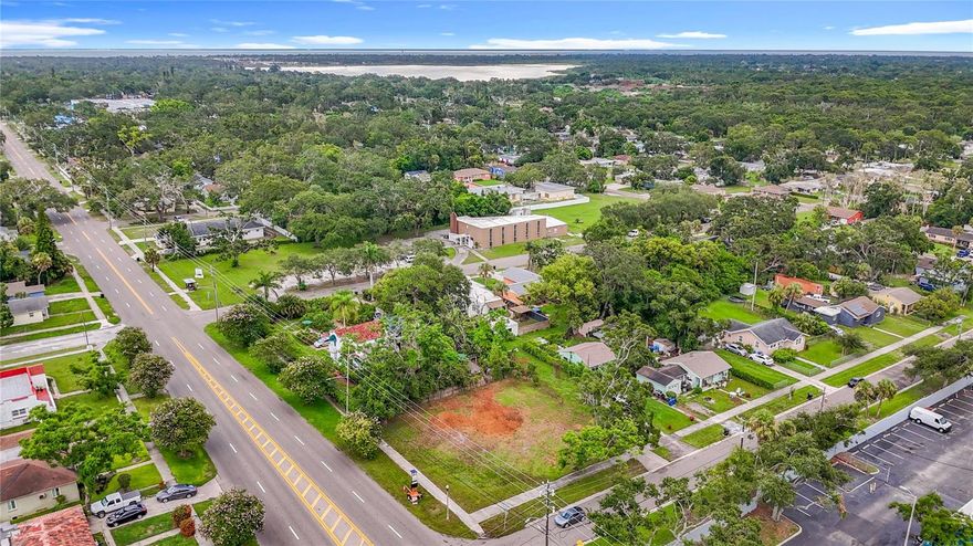 One or more photo(s) has been virtually staged. Corner vacant double lot with buildable lot letter from the city already! Great location just off 22nd Street with highly desirable NTM-1 zoning for high density residential or multifamily development! This corner lot is vacant and cleared, dimensions: 91.7 x 120 ft with a 16ft alley way. This property is NOT in a flood zone (zone X) and there is no HOA. Located just 9 minutes to downtown St. Pete, the St. Pete Pier, and less than 15 minutes to multiple beaches, marinas and golf courses. This location is prime for growth and development.

The zoning density rules allow up to 7 units total on the site. The current proposed site plan is for two 2-story duplexes (2 Bed/1.5 Bath, 1,160 Sf each) with two detached 2-Car garages with an ADU (2 Bed/1 bath, 632 Sf each) above each garage (total 6 units). An experienced developer or builder may be able to find an even better build option. Survey for the property and proposed site plan with renderings and pro-forma are in MLS attachments. The current owner is selling the lot as-is for the buyer to build or develop after closing. For an experienced investor this is an excellent build to rent opportunity with positive net cashflow. 

Buyers, please complete your own due diligence on your potential building costs and verify zoning and building rules with the city of St. Petersburg.