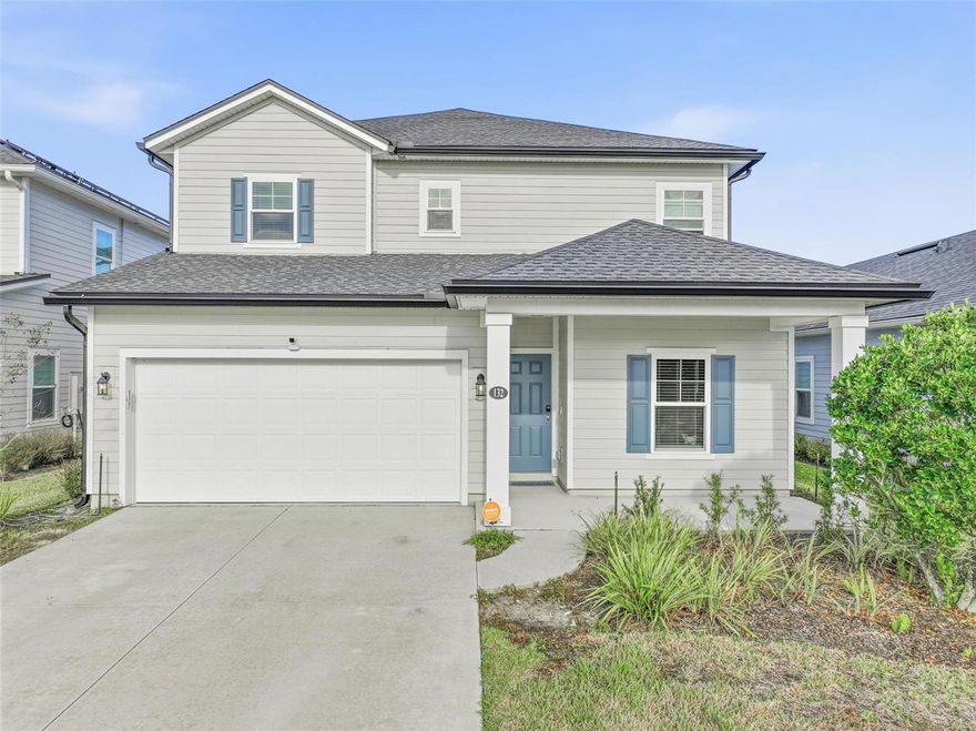 Welcome to this nearly new, two-story home located in the desirable Grand Landings community of Palm Coast. Built in 2022, this spacious residence offers 3 bedrooms, 2.5 bathrooms, and over 2,400 square feet of thoughtfully designed living space. The open-concept main level features a modern eat-in kitchen with a large island, pantry, and ample cabinetry, flowing seamlessly into the living and dining areas—perfect for everyday living and entertaining. Sliding glass doors lead to a covered lanai overlooking a peaceful preserve, providing added privacy and tranquil views. Upstairs, the generous primary suite includes a walk-in closet and en-suite bath, while two additional bedrooms offers flexibility for guests, a home office, or growing households. Additional highlights include central air conditioning, tile and carpet flooring, an attached 2-car garage, and a convenient half bath on the main floor. Situated on a well-maintained lot with irrigation, this home is part of an HOA community offering amenities such as a fitness center, walking paths, and playground. Added bonuses structural warranty and NO CDD FEES. Ideally located near shopping, dining, schools, and major roadways, this move-in-ready home combines modern comfort with a prime Palm Coast location.