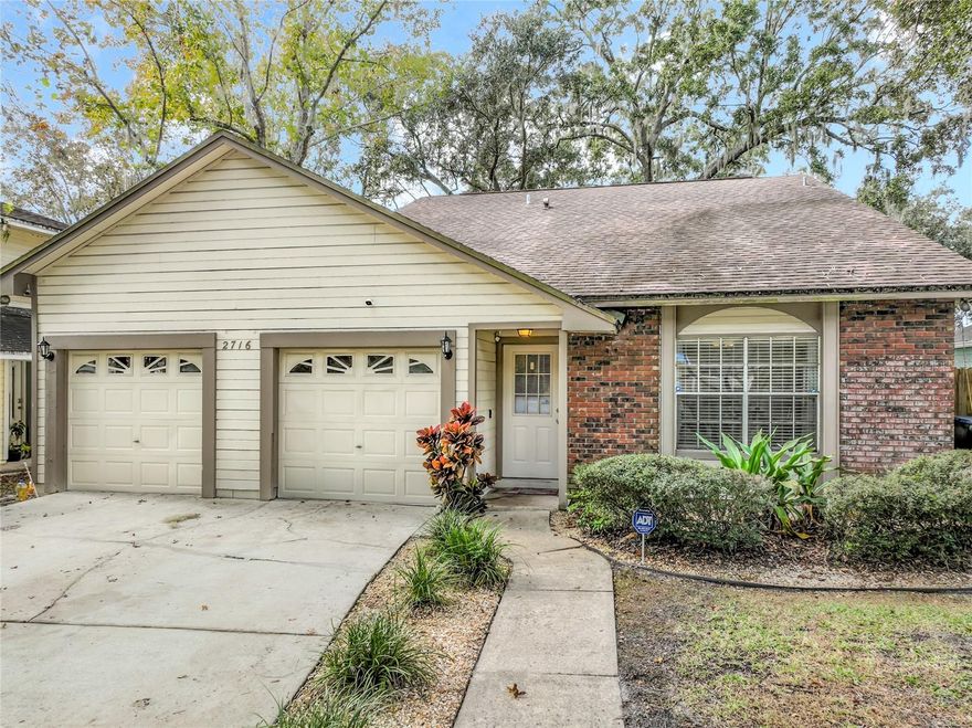 3 Bedroom and 2 Bath, 2 story home with the PRIMARY BEDROOM DOWNSTAIRS sitting on a FULLY FENCED LOT with majestic trees & POND VIEWS - a true oasis.  Light & bright Living/Dining Room combo has SOARING CEILINGS with numerous windows. Tucked away under the stairs, off the great room, is a REMODELED 1/2 Bath with wainscot detail as well as storage space. The REMODELED sunny kitchen contains Stainless Steel Appliances, QUARTZ Counter Tops, Tile Backsplash, large double door pantry, new recessed lights, and a brightly lit eat-in area  containing a bay window overlooking the backyard & pond. The PRIMARY BEDROOM DOWNSTAIRS WITH A POND VIEW is of generous size with a REMODELED BATHROOM containing a spacious shower as well as DOUBLE SINKS. Both bedrooms 2 & 3 are of generous size, double door closets and face the pond. The upstairs bath contains a tub for baths, as well as an extra-large dueled mirrored cabinet. The backyard contains a PAVED PATIO AREA - perfect for grilling and socializing. There is also a COVERED GAZEBO for hanging out. The garage is oversized (24 x 22) with built-in workbench, storage cabinets and an entire wall of peg board to hang tools &  other stuff.  This garage is a space saver for all your items you don't know what to do with!  Recent updates include NEW A/C (2024), Exterior Paint (2019), Re-Pipe (2018), Roof & Water Heater (2015). Extremely LOW HOA fees $250 Annually. Community Gate access to the Elementary School. EZ access to airport, Waterford, Lake Nona, and Sodo/Downtown areas. This is home is priced to sell, DO NOT PROCRASTINATE!