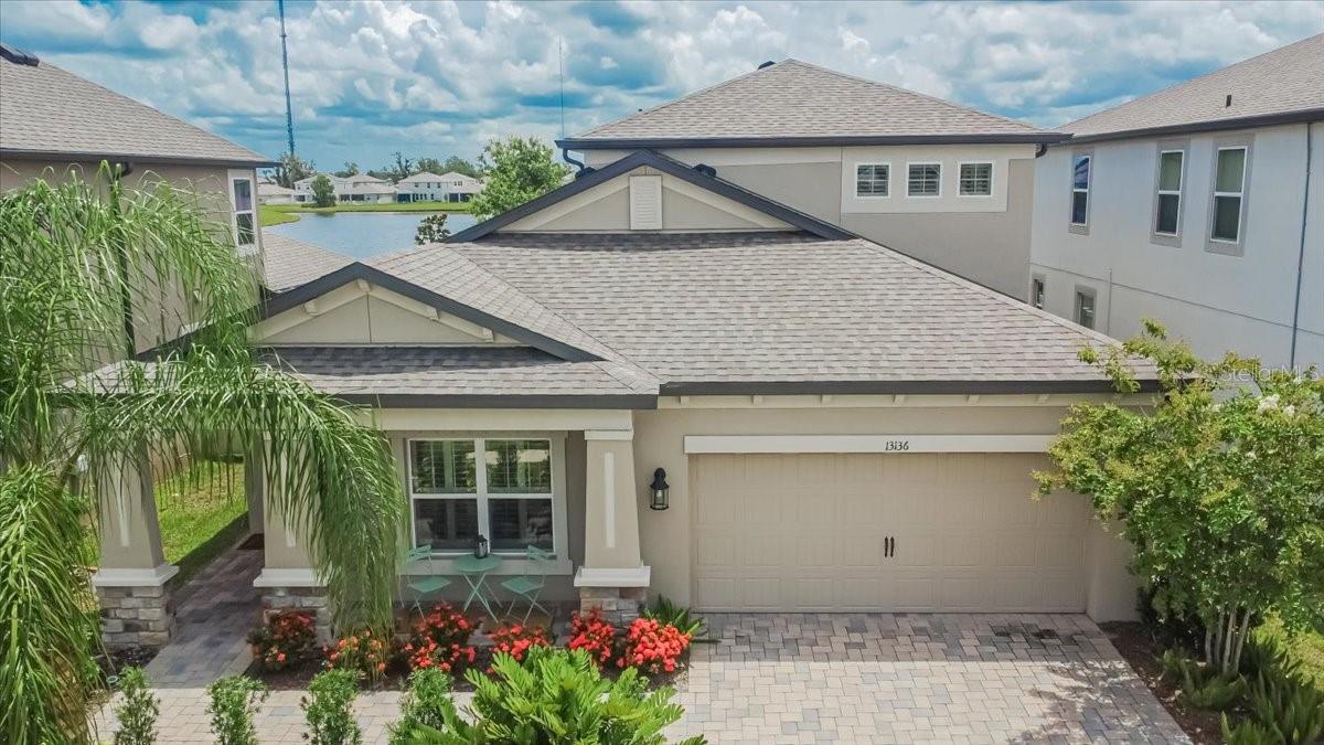 Welcome to Your Dream Home with Pond Views and $50K+ in Upgrades!
This stunning and spacious 5-bedroom, 3-bathroom home has it all—style, comfort, and functionality—nestled in a beautiful community with resort-style amenities including a pool, playground, and tennis courts.
Step inside and be wowed by the upgraded tile flooring throughout the main living areas, tray ceilings in the oversized first-floor primary bedroom, walk in closets and a large primary bath. Plantation shutters throughout the home offer elegance and timeless appeal, enhancing the aesthetic of any room while providing exceptional light control and privacy. The front bedroom offers the perfect space for a home office or den, while upstairs, a private bedroom, bathroom, and spacious loft (pre-plumbed for a wet bar!) provide an ideal setup for guests or multi-generational living.
The gourmet kitchen is a true showstopper—featuring stainless steel appliances, flat cooktop, double ovens, quartz countertops, custom pantry shelving, rollout cabinets, and an oversized island made for entertaining.
Enjoy evenings on the porch overlooking the peaceful pond, or sip your morning coffee from the charming front porch. Additional highlights include a paver driveway, blackout roll blinds on the slider, vinyl fenced backyard, wood staircase, and ceiling fans throughout.
Efficiency meets comfort with split AC systems in both the primary bedroom and garage (which also features durable epoxy flooring). A full water filtration and conditioner system adds to the home's exceptional value. TVs are included—making this home truly move-in ready.
This is more than just a house—it’s a lifestyle upgrade. Come fall in love with everything this incredible home has to offer! (Furniture available for purchase outside of home sale-see attachment for list)