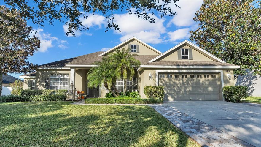 Welcome to the serene and exclusive Estates of Auburndale, a gated community surrounded by lush, mature hedges and a lifestyle of elegance, comfort and convenience. Low HOA and NO CDD! As you drive through this remarkable community, you'll notice the well-maintained homes that create an ambiance of beauty and elegance where residents invest in their homes. Now, the opportunity awaits you to own a stunning 3-bedroom, 2-bathroom home with a flexible space that can be transformed into a den, office, or whatever suits your needs. This home boasts 2018 square feet of living space and a total of 2847 square feet situated on a generous lot of a quarter acre! A brand new roof completed November 2023 to eliminate all your worries of a HUGE expense. Admire the updated pavers that were installed on each side of the driveway ensuring easy access to and from your vehicle while adding a touch of beauty to your property presence. As you walk to the front door this home welcomes you with the well -manicured yard, lush green grass and perfectly groomed hedges and pre-matured trees that present you to an inviting front porch with a sitting area. Step on in to the open floor plan with spectacular laminate flooring that gleams as it basks in the natural sunlight that streams through the exceptional sliding glass doors. The living room serves as the heart of the home, with the kitchen and dining room situated off of it, making family gathering or entertaining a breeze with cooking and socializing together. A chefs kitchen awaits you with beautiful JettaStone countertops with plenty of space to prep your meals, a stainless steel farm sink, stylish backsplash, plenty of cabinetry for storage, and a breathtaking kitchen nook, perfect for morning gatherings before you start your day . The owners' suite is 13x19 featuring Berber carpet, a beautiful tray ceiling, access to the screened in lanai through the sliding glass doors and a master bathroom that is sure to capture your heart with its deep garden tub, perfect for hot bubble baths to unwind and rejuvenate. Dual sinks adding convenience to your morning or evening routine and a nice walk in closet. You'll find the other 2 bedrooms and the office right off the living room offering family and guests their own space. Bedroom 2 and 3 have Berber carpet, ceiling fans and access to the second bathroom that has a spacious linen closet and direct access to the screened in lanai. The screened in lanai overlooks the backyard, a space to enjoy the outdoors, rain or shine. The backyard itself is an oasis with thick, healthy grass and a fully fenced in yard, providing both privacy and security. Updated pavers ensure easy access to the side of the house, allowing gate access. There's plenty of room to install a future pool, or simply enjoy the open space for entertaining and recreational activities. Ride your bike or take a stroll to the community pool which has a kiddie and adult pool, playground, basketball courts and a turtle habitat that is exceptional to see. Minutes from I-4 and Polk Parkway making commutes friendly.  This is more than just a house; it's an opportunity to become a part of a thriving, vibrant community where pride of ownership and a warm welcoming spirit are the cornerstones of everyday life. Don't miss the chance to be a part of this exceptional community, make this house your HOME today.