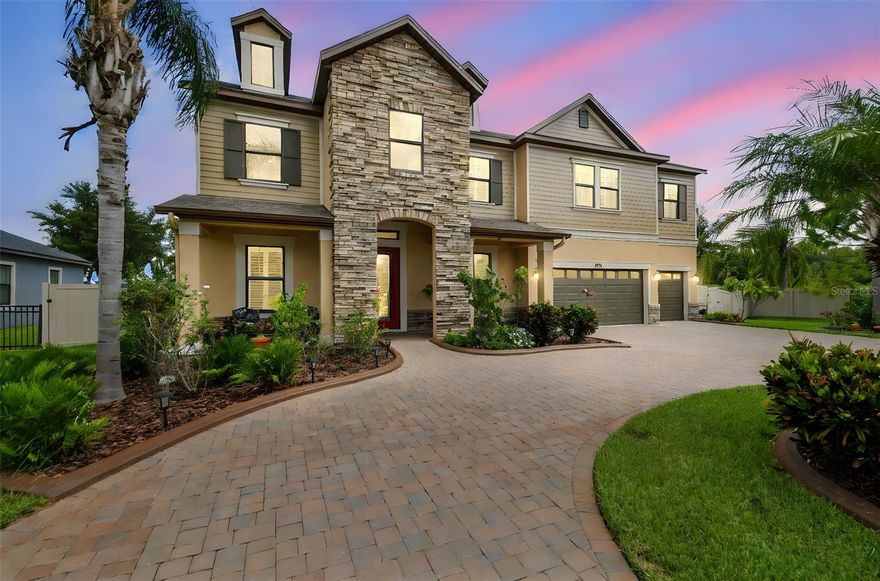 Conveniently Located Private Lakefront Estate | 5 Bedrooms | 5.5 Bathrooms | 4,200+ Sq Ft | 3-car Garage

Enjoy the perfect blend of convenience and tranquility! Ideally located near I-75 and the Suncoast Parkway, this home offers easy access to the Premium Outlet Mall, exceptional dining, entertainment, and endless recreation — all while providing a peaceful place to unwind at the end of the day. Set along the pristine shores of the 200-acre Lake Padgett, one of Land O’ Lakes’ most exclusive and coveted ski lakes, this exceptional custom-built lakefront estate offers a rare fusion of timeless elegance, modern comfort, and resort-style living. Positioned on a beautifully manicured homesite exceeding half an acre, the residence delivers privacy, sophistication, and breathtaking waterfront views.
Spanning more than 4,200 square feet, the home features five gracious bedrooms and five and a half baths, thoughtfully designed to accommodate both intimate daily living and grand-scale entertaining. Included with the property is a private floating dock—providing immediate access to boating, paddleboarding, fishing, and sunset cruises directly from your backyard.
The interior is defined by soaring ceilings, expansive windows, and an elegant formal living and dining area that captures sweeping lake views. At the heart of the home, the open-concept kitchen and family room flow seamlessly to the dramatic two-story screened lanai, overlooking the gas-heated pool and spa and the tranquil waters beyond. This effortless indoor-outdoor connection creates an atmosphere perfectly suited for refined entertaining and elevated everyday living.
The main level offers exceptional convenience with a private in-law or guest suite featuring its own en-suite bath with large walk-in shower, complemented by a separate full pool bath and an additional half bath for guests when visiting.
Upstairs, a spacious loft provides a flexible retreat for media, recreation, or relaxed gatherings. The primary suite serves as a serene sanctuary, complete with dual walk-in closets and a spa-inspired bathroom featuring a soaking tub, dual vanities, and an oversized walk-in shower with rainhead. From the suite, step onto the full-width upper balcony to enjoy unobstructed views of the pool, lush grounds, and shimmering lake—an ideal backdrop for morning coffee or evening unwinding.
Additional upstairs accommodations include an expansive double-sized bedroom with an oversized walk-in closet and two generously proportioned bedrooms connected by a refined Jack-and-Jill bathroom.
Designed with both luxury and functionality in mind, the home includes pre-wired surround sound, a pre-plumbed water softener loop, abundant garage storage, and a full two-story screened enclosure that enhances year-round outdoor living. The resort-inspired grounds feature an expansive pool deck, a built-in fire pit, a fully fenced backyard, and an irrigation system supplied by well water.
Completing the offering are a paved circular driveway, five overhead garage storage racks, and direct lake access via a shared dock with only one neighboring residence, all within a private gated enclave. This is a rare opportunity to own a true lakefront estate where every detail has been curated to deliver an elevated lifestyle defined by elegance, privacy, and natural beauty.

Offered by private appointment, this Lake Padgett estate invites you to experience waterfront living at its finest.