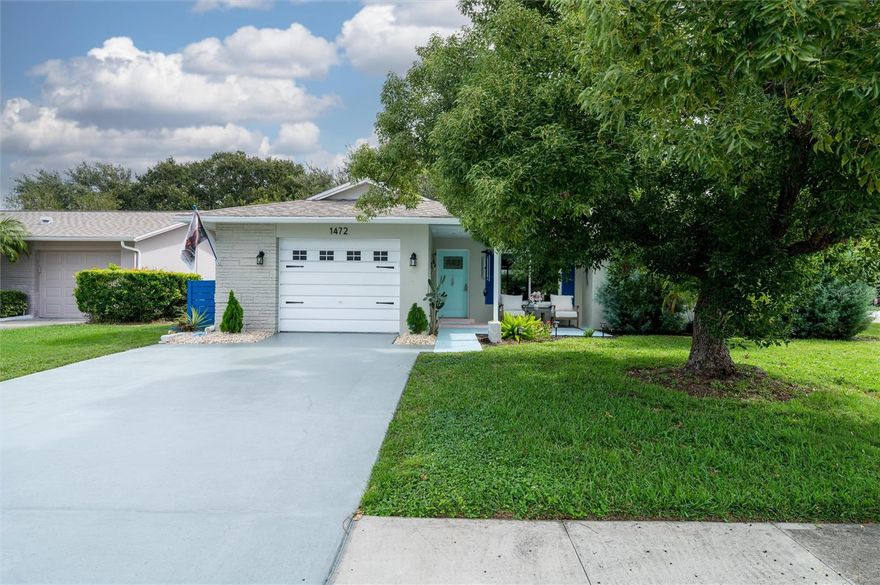 Come experience the best of Highland Lakes on Lake Tarpon — a vibrant 55+ active community!
$5,000 towards closing costs!!! This beautifully remodeled, turnkey 2-bedroom, 2-bath home is perfectly situated on a spacious corner lot, featuring an inviting front porch and a backyard designed for outdoor entertaining. Step inside to discover elegant porcelain tile flooring, stylish built-ins on a tiled accent wall, and a bright, open layout filled with natural light. The galley kitchen shines with stone countertops, a new backsplash, and updated cabinetry. Enjoy peace of mind with newer upgrades throughout — including the roof, storm windows, AC, stainless steel appliances, modern lighting, and ceiling fans. A cozy family area connects seamlessly to the sunroom, creating an ideal indoor-outdoor living space. The thoughtfully landscaped exterior offers privacy and tranquility, perfect for relaxing or entertaining. Highland Lakes offers resort-style amenities, including three 9-hole executive golf courses, tennis and pickleball courts, pontoon boats with available boat slips, RV storage, an Olympic-size pool and spa, auditorium, and endless clubs and social events. All just minutes from Dunedin, the famous Sponge Docks of Tarpon Springs, and the white-sand beaches of Honeymoon Island. Don’t miss the opportunity to make this beautifully updated home yours!