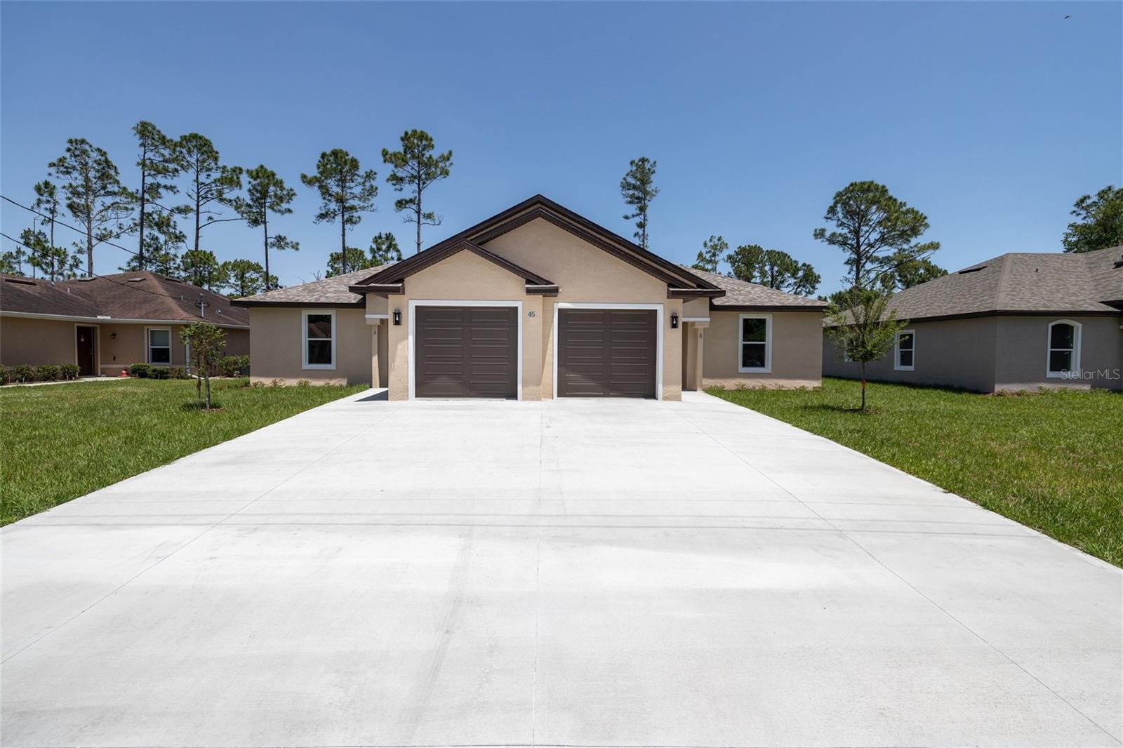 Brand New Duplex on a freshwater canal!!!! Many upgrades throughout: 12 ft. Trey ceilings, luxury vinyl waterproof floorings with extra high baseboards, tile, upgraded Kitchen with SS appliances including refrigerators, 42-inch Cabinets, Granite counter tops, kitchen island, sliding doors with blinds in between to reduce dust, Ceiling fans, LED light fixtures, as well as painted flooring in the garage (each unit got 1 car Garage with Remote Opener, access to attic. Each unit has 1185 Sq. Ft..). Master suite has trey celling, walk in closet and in suite bathroom, instant (tankless) water heater, kitchen exhaust fan and more. Excellent investment opportunity,1031 Exchange or you can live on one side and rent the other. Also great for larger families.