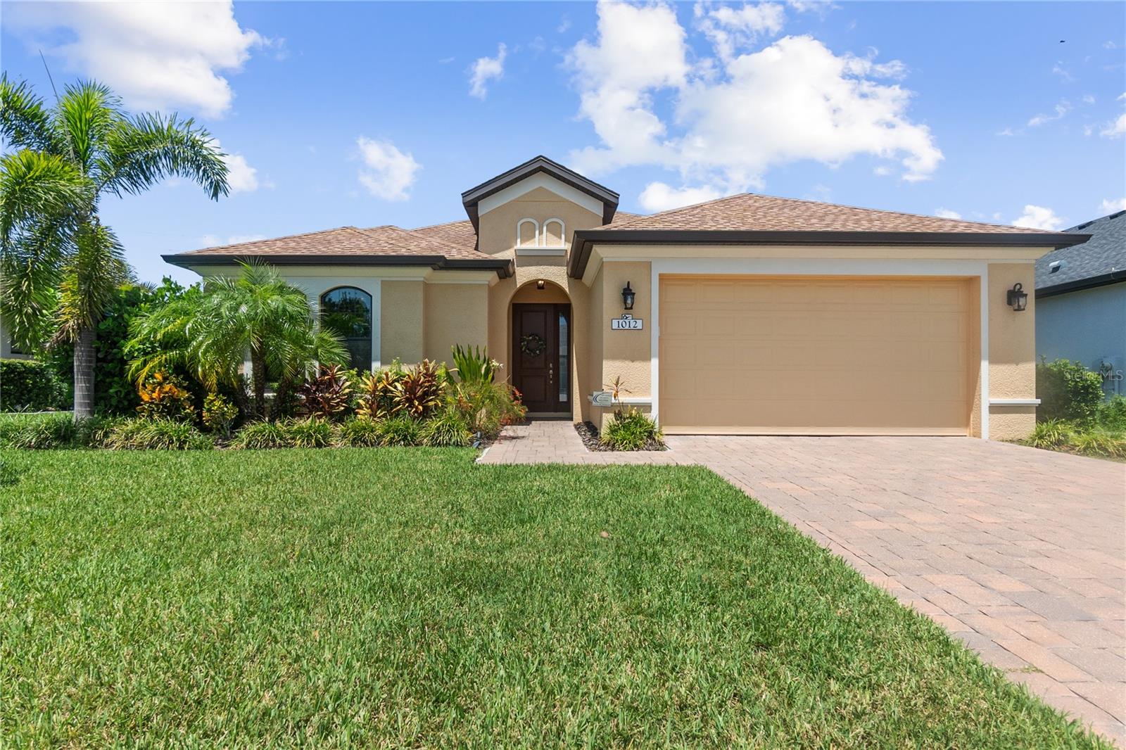 Welcome to 1012 Siberian Glen, a move-in ready single-family home located in the highly desirable gated community of Greyhawk Landing in Bradenton, Florida. This well-maintained residence offers 1,995 square feet of thoughtfully designed living space, featuring three spacious bedrooms and three bathrooms—an ideal layout for today’s modern lifestyle.
Inside, the open-concept floor plan is anchored by a kitchen that blends function with style. Rich chocolate-colored cabinetry is complemented by sleek granite countertops, creating a warm, timeless aesthetic. The kitchen flows effortlessly into the main living and dining areas, making the space equally suited for relaxed family living or entertaining. The split-bedroom design ensures privacy, and the primary suite serves as a quiet retreat with an en-suite bath and generous closet space. With neutral finishes and updated systems throughout, this home is move-in ready with no renovations needed.
Step outside to a private screened lanai overlooking a peaceful backdrop with no rear neighbors—offering both tranquility and privacy. The screened patio is already plumbed with gas, electric, and water, giving future homeowners the perfect foundation to build their dream outdoor kitchen.
Greyhawk Landing is a gated, master-planned community known for its resort-style amenities and strong sense of community. Residents enjoy access to two expansive clubhouses, lagoon-style pools, a fitness center, tennis and pickleball courts, sports fields, playgrounds, and miles of walking and biking trails surrounded by more than 400 acres of preserved natural space. Located minutes from Lakewood Ranch, I-75, top-rated schools, and the Gulf Coast's renowned beaches, this home offers a rare blend of comfort, convenience, and Florida living at its finest.