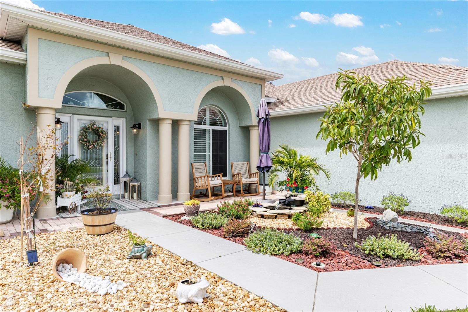 WELCOME TO THIS GORGEOUS GOLF COURSE HOME IN THE HIGHLEY DESIRABLE GATED COMMUNITY OCALA PALMS GOLF AND COUNTRY CLUB. It’s time to enjoy your new Florida lifestyle in this FABULOUS home which has two bedrooms, two full bathrooms, a two car garage and a fanstatic GOLF CART GARAGE. This home is full of custom features and beautifully appointed upgrades. As you enter the foyer, you’ll immediately notice the vista views of the golf course frontage on the 13th fairway. The triple sliders in the living room lead directly to the florida room and they open all of the way into a pocket which gives the home a feel of bringing the outdoors in. The living room and formal dining area are spacious and beautiful. You’ll need to catch your breath as you enter the island kitchen which is open to the large family room. All of the kitchen appliances are included. The family room overlooks the golf course and the family room sliding doors lead to the florida room. Your new home is a split plan. Each bedroom has its own privacy. You’ll love the large master bedroom which easily fits a king sized bedroom suite. Just like the living room and family room the master bedroom also has sliding doors that leads to the florida and offer continued views of the golf course. The master bathroom is lovely as it has a walk in shower and double sinks. The other side of the home has the guest bedroom in which the hallway has a pocket door to make your guests feel amazingly comfortable with extra privacy. The big ticket items have already been taken care of for you. The roof was replaced in 2022, the AC was replaced in 2022, and a new front door was installed in 2022. You'll love this home as it beyond impressive.