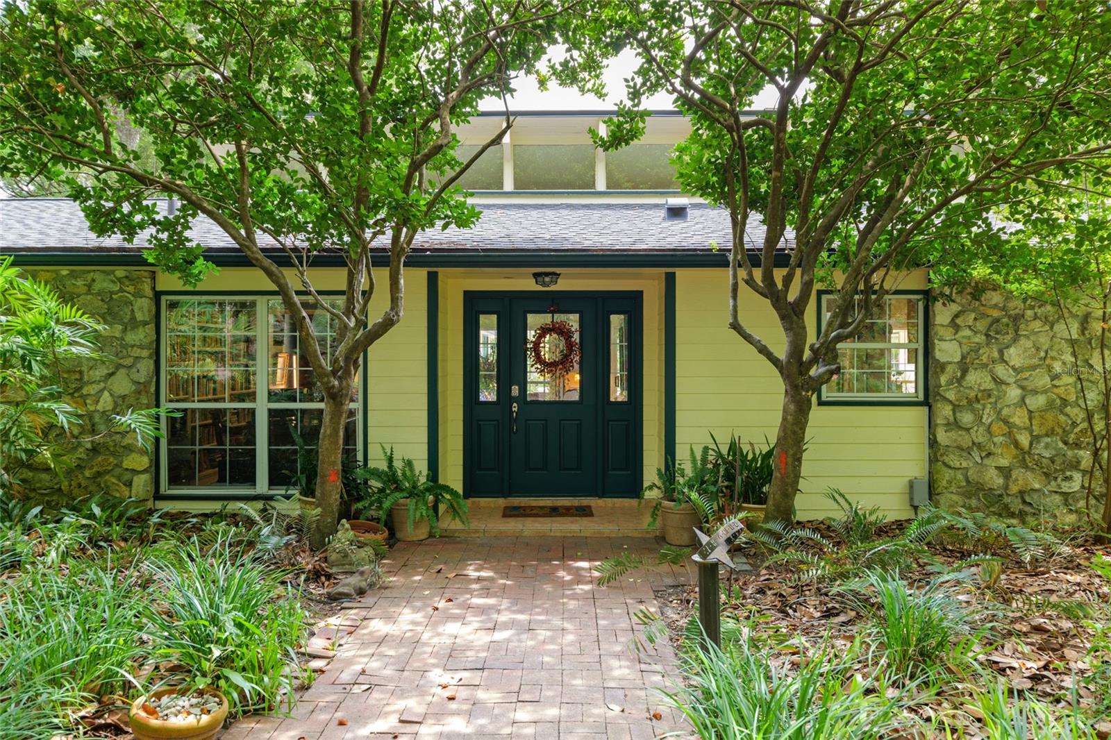 Privacy, Charm and Scenic Beauty! Welcome to your own private retreat! This enchanting cottage-style home offers cozy comfort and timeless character, all nestled on 7 picturesque, park-like acres. Thoughtfully designed to embrace indoor-outdoor living, the home wraps around a charming terrace and sparkling pool area, perfect for relaxing or entertaining. Tucked just minutes from town on a paved road, the property features a new asphalt private drive for easy access. Recent updates include a brand new roof (2024) and fresh paint inside and out, making this move in ready gem shine. Whether you're looking for a peaceful getaway or a unique forever home, this property offers the best of both worlds - serenity and convenience.