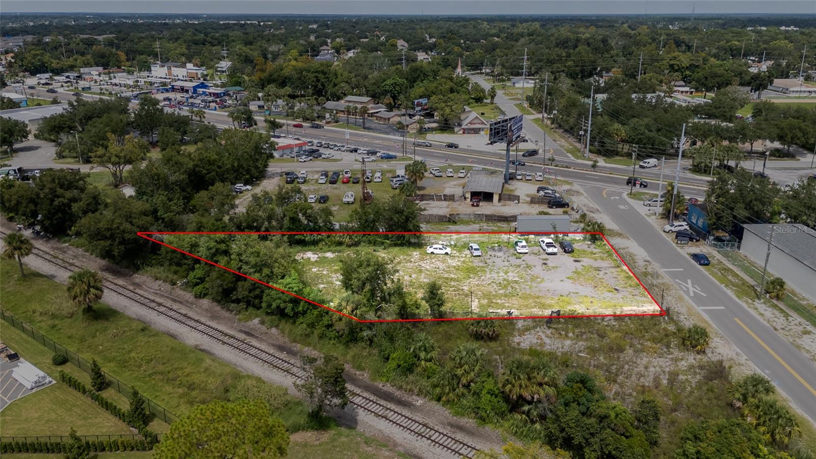 Prime C-2 General Commercial lot in the heart of Apopka—just off W Main St/US-441 (Orange Blossom Trail) and minutes to SR-414/429 (Apopka Expressway/Wekiva Pkwy) for fast regional access. Surrounded by ongoing growth, including the Apopka City Center anchored by a new Winn-Dixie and additional retail/medical uses along Main Street. Hospitals, services, and dense neighborhoods nearby support a wide range of commercial concepts (think retail, restaurant, professional/medical office, personal services, and auto-oriented uses), consistent with the C-2 “General Commercial” district and Orange County’s Use Table. High visibility near a major corridor that carries significant daily traffic by FDOT and Orange County traffic count data—excellent for signage and destination uses. Utilities nearby; flat site for efficient development.