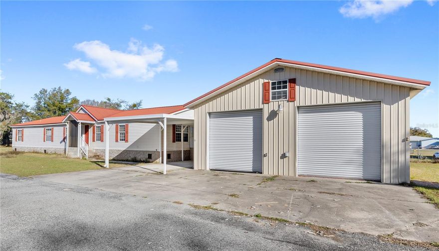 2005 Manufactured home for sale on 1.49 ACRES. Home is 2,432 square feet with four bedrooms and two full bathrooms. Needs some renovation.  New LIFETIME METAL ROOF was installed in 2015.  PRIVATE LOT at the end of Memory Lane with mature oak trees; flat and dry.  NO HOA.  Also included is a 1974 three bedroom three bathroom manufactured home which is 1,344SF, needs extensive renovation.   WORKSHOP and carport breezeway were added in 2006.  Workshop is 1,080SF.  Features high ceilings with overhead storage, TWO ROLL UP DOORS, plumbing and electricity, bathroom and TWO OFFICES, one of which is a 'hurricane room'.  Home is wired for a generator.  Property also features a car port and another storage shed in the back!   
Property has two separate wells, septic, and electrical meters.  In the heart of Leesburg with easy access to shopping, schools, and medical.