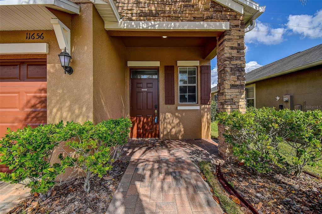 Photo of 11656 Lake Boulevard, New Port Richey, FL 34655 (MLS # TB8444436)