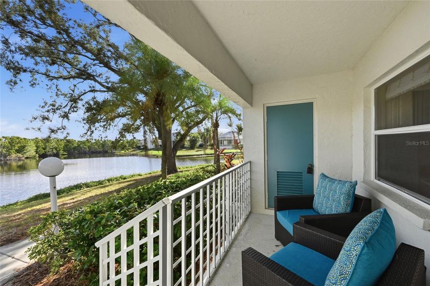 Great Price Reduction! Lakefront and Located just 1.5 miles to the Anna Maria Island bridge. You can walk or bike ride to the beautiful turquoise Gulf of America and white sand beaches!  Water views from every room and porch! BEAUTIFUL open and bright 1st floor, dog friendly condo!  Great for full time living, a weekend getaway, winter home or investment property. This meticulously remodeled residence is filled with natural light from abundant windows and offers peaceful views of the water and surrounding trees, where beautiful birds...roseate spoonbills, eagles, osprey and more can be seen right outside. Another enclosed lanai overlooking the lake is perfect for an office. Featuring over 1,400 square feet, the home showcases quality cabinetry, upgraded appliances.  And it comes with a carport and 2 outside storage rooms for bikes and beach stuff! Next to Robinson Preserve, this condo offers the perfect blend of coastal living and nature. Enjoy a peaceful, beautifully landscaped community that feels like having your own private yard right on the lake. Residents also enjoy access to a waterfront clubhouse with pool, grill, pickle ball court, fitness center and sauna, library, pool table and kitchen for owners to use. A truly special opportunity in a prime location!  Building just received a new roof and paid for by seller.