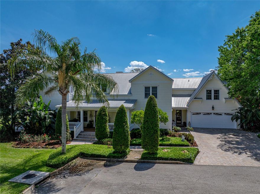 CAPTIVATING LAKEFRONT PROPERTY! The stunning residence and its grounds beautifully merge modern luxury with its early 20th century design. Nestled in the heart of Florida on 1.07 acres, this impressive home offers 7,200 sq. ft., 5BD/ 5 full bathrooms, 2 half bathrooms, plus a guest cottage! The charming front porch is inviting into the entry hall that features a staircase to upstairs and leads to the formal living room with adjacent formal dining room. The home has spacious rooms for family living and when entertaining guests. The family room is grand with over 780 sq. ft. showcasing meticulous mill work, gorgeous marble floor and a wall of windows overlooking the massive pool area and across Lake Eva. The huge gourmet kitchen will delight the family’s chef, it is outfitted with top-of-the-line appliances and custom finishes that elevate the home's beauty and functionality. A home-office includes a ½ bath, lakeview and features the warm elegance of craftsmanship found throughout. The upstairs gives the bedrooms quiet seclusion and comfort in size, numerous bathrooms and access to an enormous balcony that captures a mesmerizing view across the lake and landscape of Polk County. The owners’ suite is a serene retreat with space galore and lavish design accommodating a dressing room, luxury bath with sizeable, jetted spa/tub; a connecting bedchamber with a wet-bar, stunning wood ceiling, large windows and access to the sprawling 2nd level deck with stairs to the backyard and pool area. Stone decking surrounds the large pool, a hot tub, patio areas and a pathway to an adorable guest cottage. This luxury estate offers a perfect resort-type living for family and for entertaining guests. The Central Florida location is fabulous and convenient to all necessities and a short distance to Orlando for fine dining, arts and airport. Call today to experience this beautiful, extraordinary residence with a private tour!